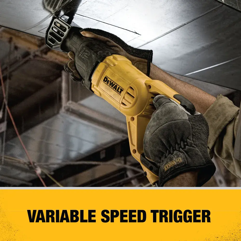 A person using a yellow DEWALT reciprocating saw with gloves to cut a metal surface, demonstrating the tool's variable speed trigger.