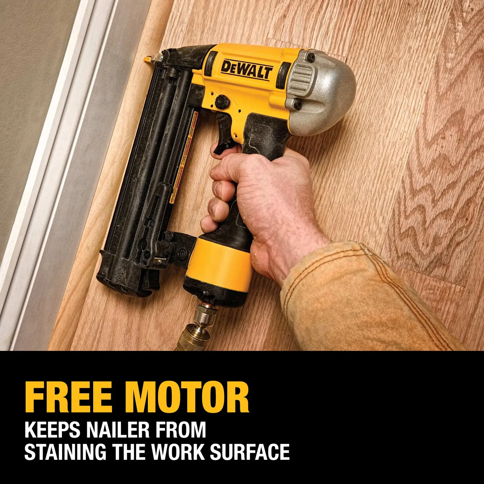A person uses a DEWALT nailer on a wooden surface, demonstrating the product's 'free motor' feature that prevents staining the work area. The text highlights: 'FREE MOTOR - Keeps nailer from staining the work surface.'