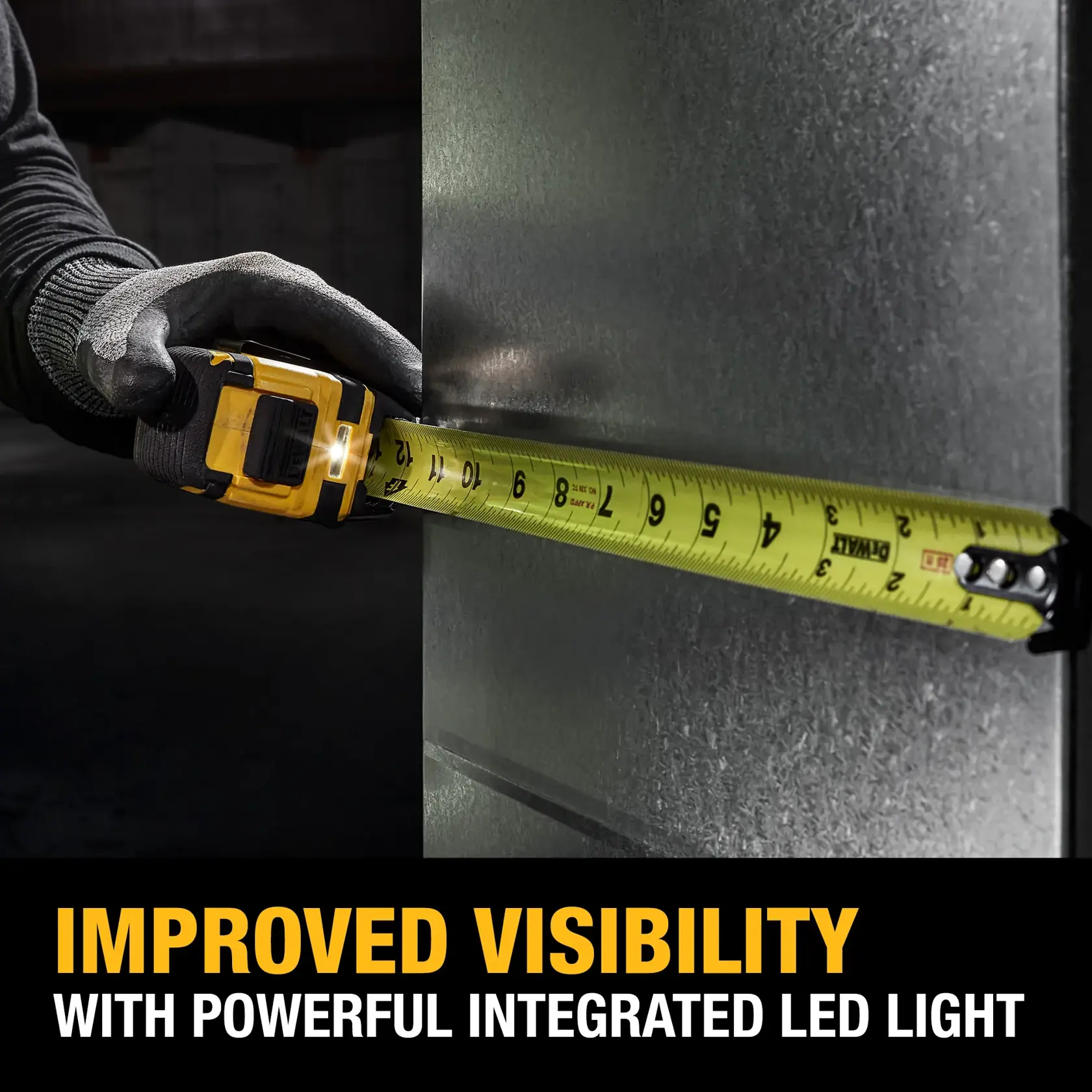 A person wearing gloves uses a yellow DEWALT tape measure with an integrated LED light to measure a metal surface. The image highlights improved visibility due to the LED light, with text at the bottom reading 'Improved Visibility with Powerful Integrated LED Light.'