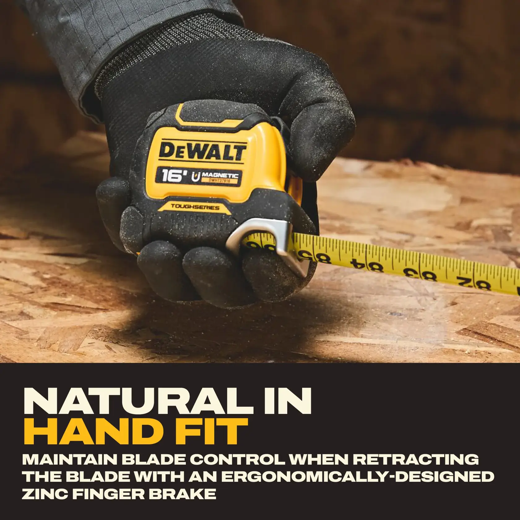 A gloved hand holding a DEWALT 16-foot magnetic tape measure on a wooden surface. The tape is extended, and the product emphasizes ergonomic design with a zinc finger brake for improved blade control.