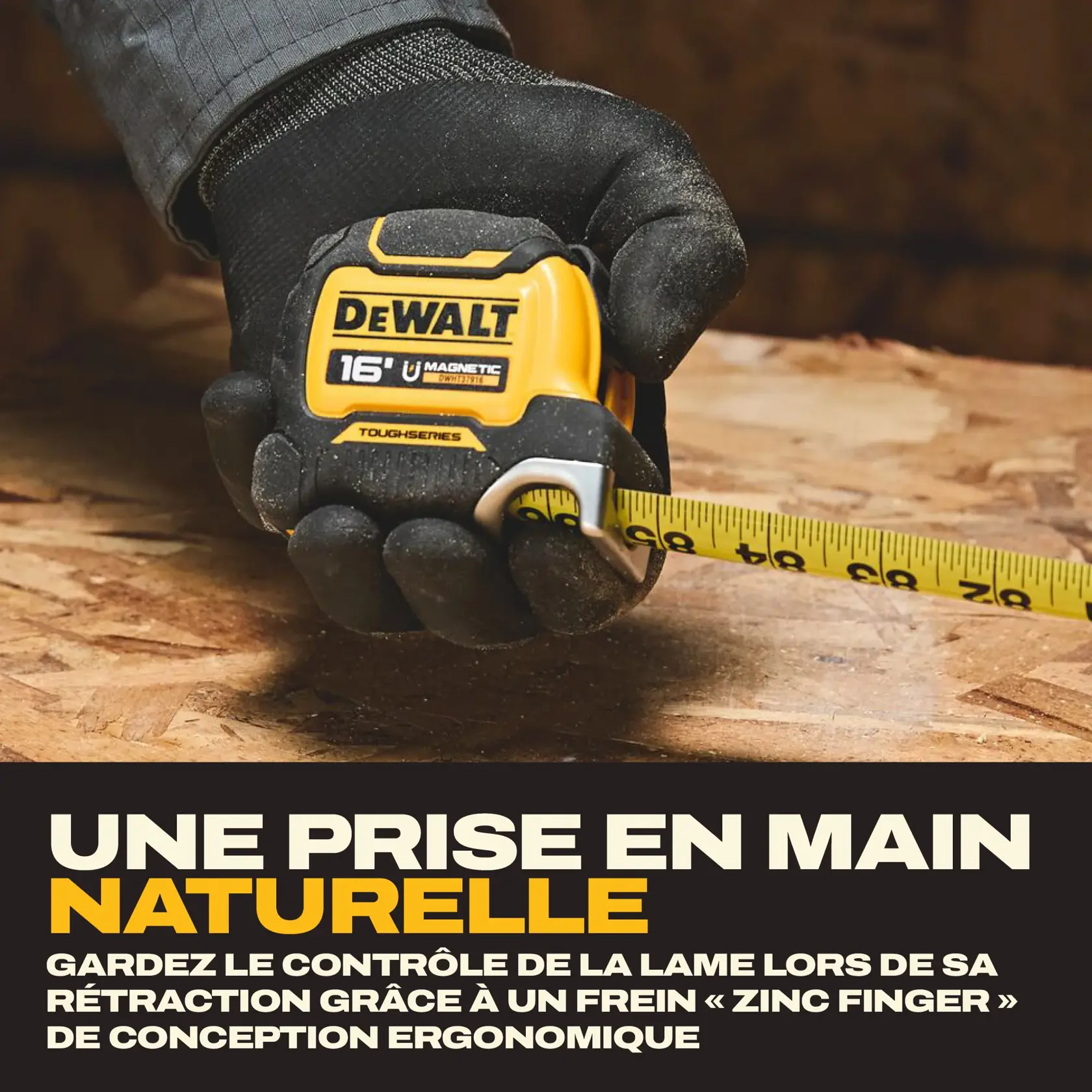 A gloved hand holding a DEWALT 16-foot magnetic tape measure on a wooden surface. The tape is extended, and the product emphasizes ergonomic design with a zinc finger brake for improved blade control.