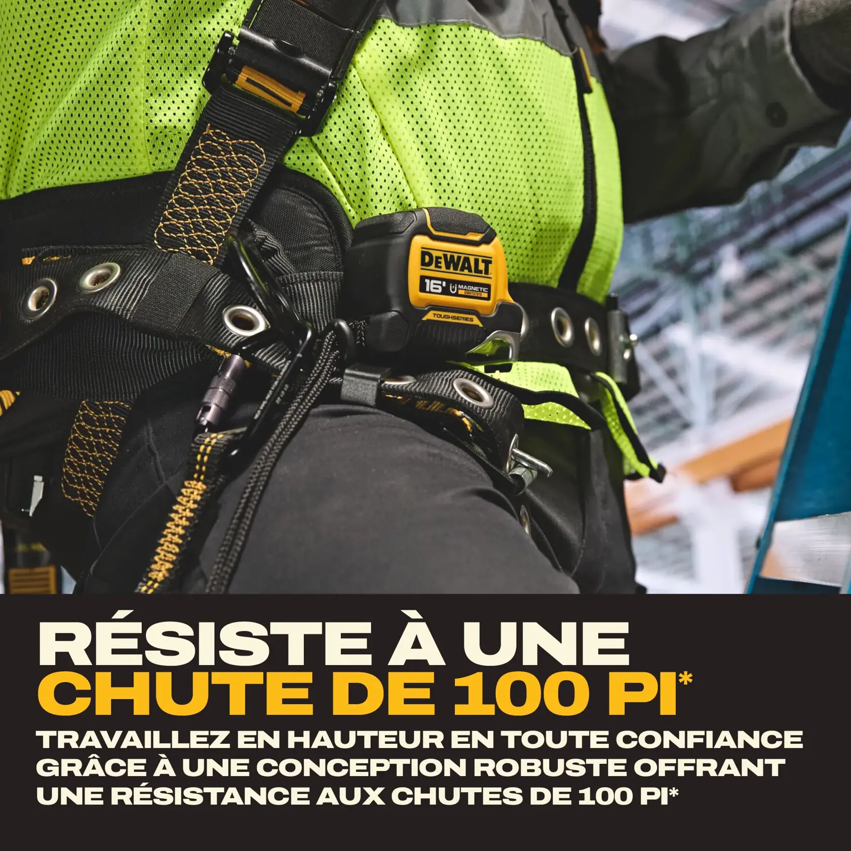Close-up of a DEWALT 16 ft magnetic tape measure attached to a worker's safety harness. The worker is wearing high-visibility clothing and appears to be on a jobsite. Text in the image highlights the product's 100 ft drop rating and its durable design for working at heights.