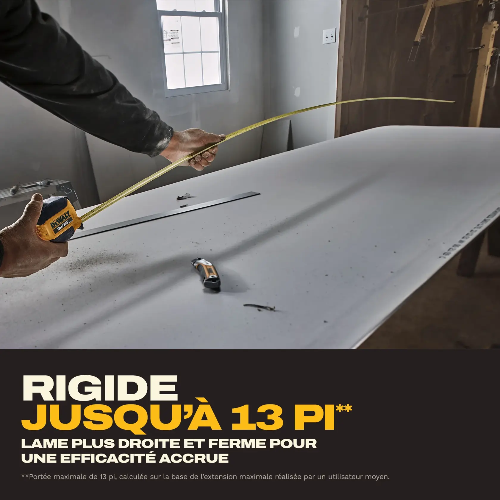 A person measures a long distance on a work surface using a DEWALT tape measure, with the tape extended. Text on the image highlights the 13 ft. max reach of the tape, emphasizing straightness and strength for improved efficiency. Other tools are visible on the work surface.