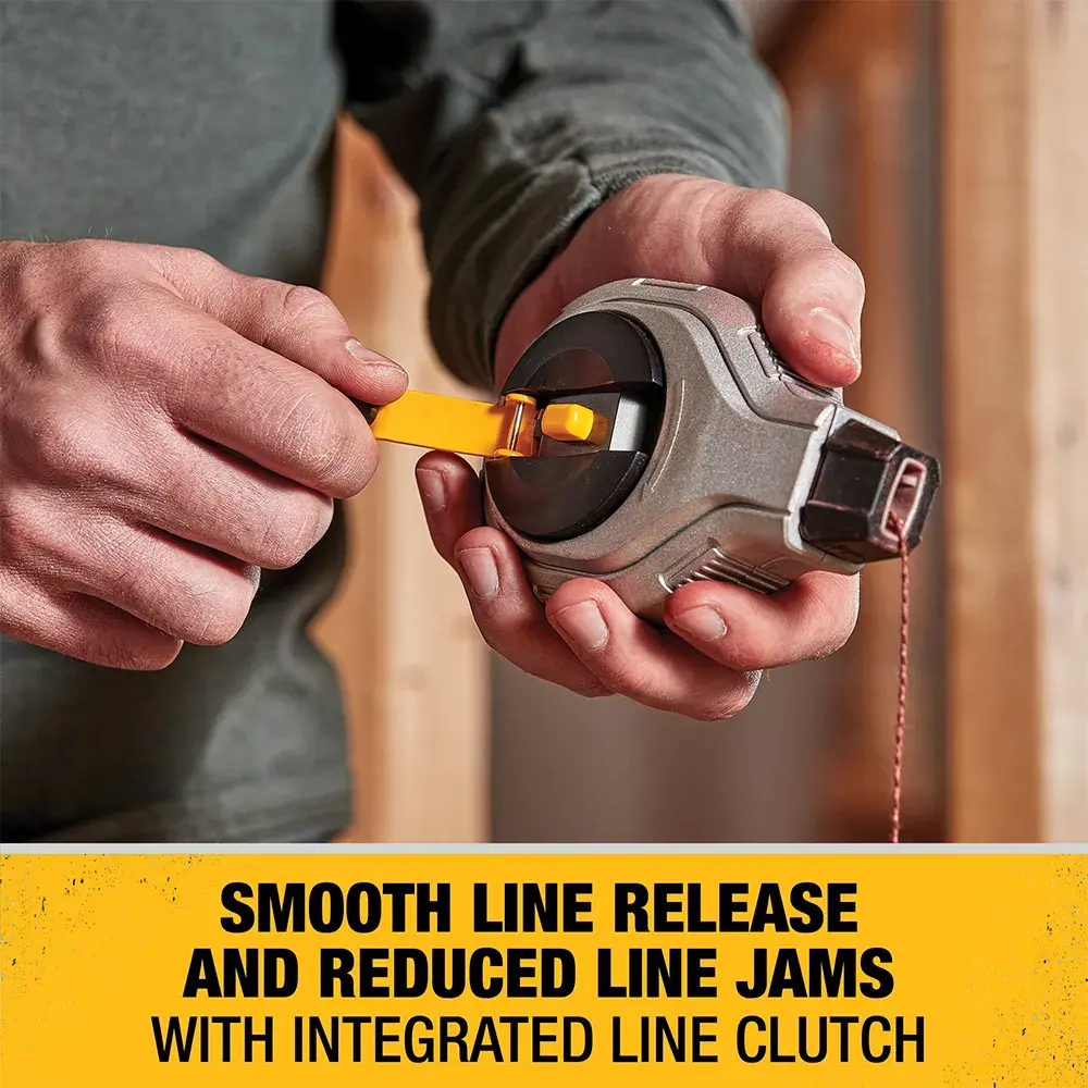 A person using a DEWALT chalk line tool, showing a smooth line release and reduced line jams with an integrated line clutch. The tool is held in hand and highlighted by a yellow tag in the image.