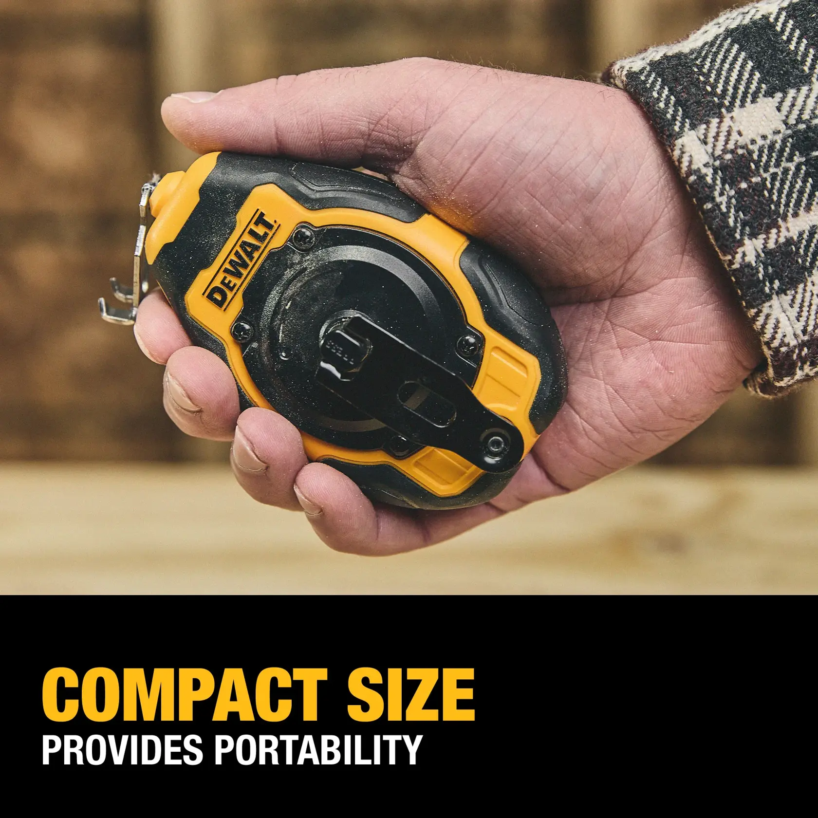 A person holding a compact DEWALT chalk line tool in their hand. The tool is black and yellow, designed for portability. Text below reads: 'Compact Size Provides Portability.'