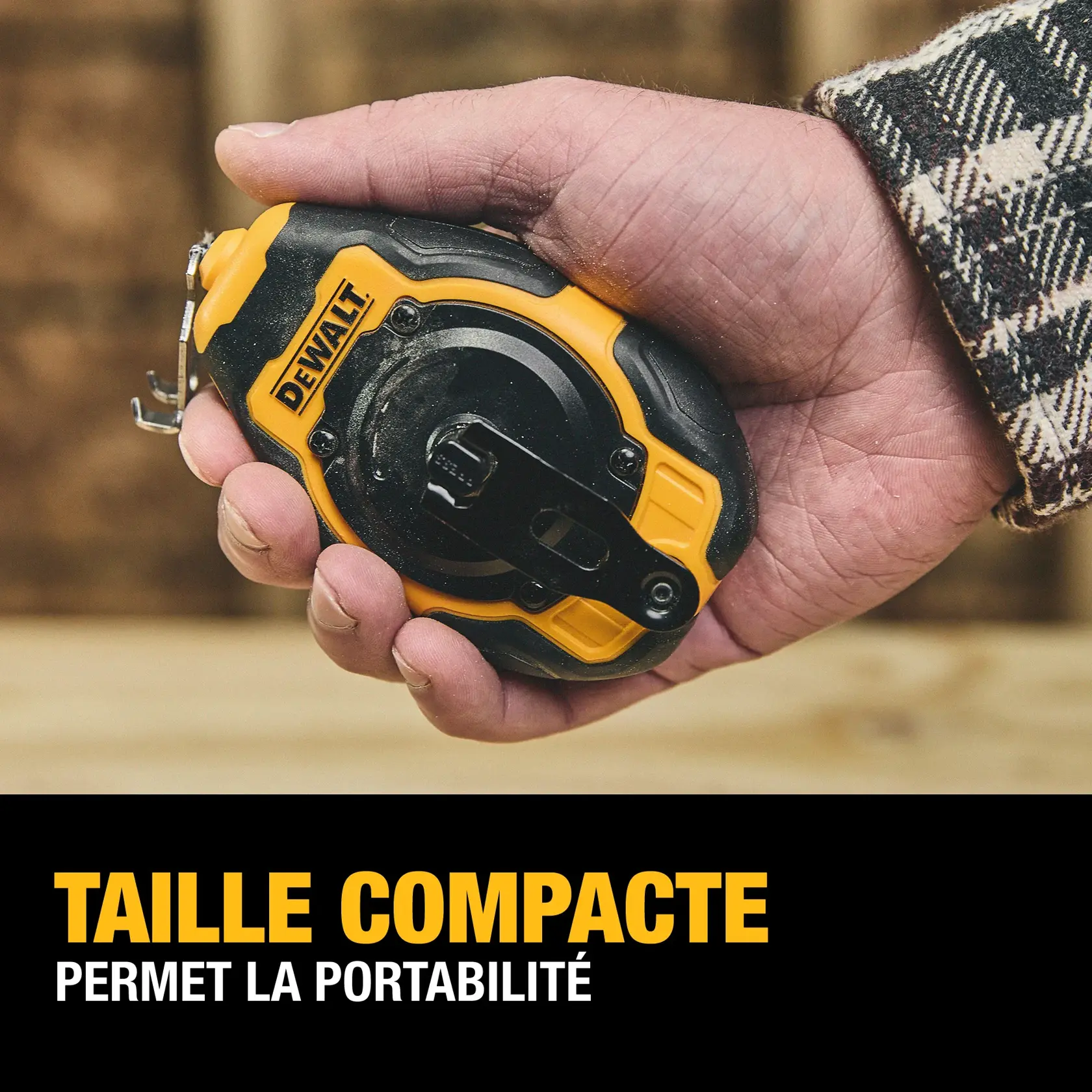 A person holding a compact DEWALT chalk line tool in their hand. The tool is black and yellow, designed for portability. Text below reads: 'Compact Size Provides Portability.'