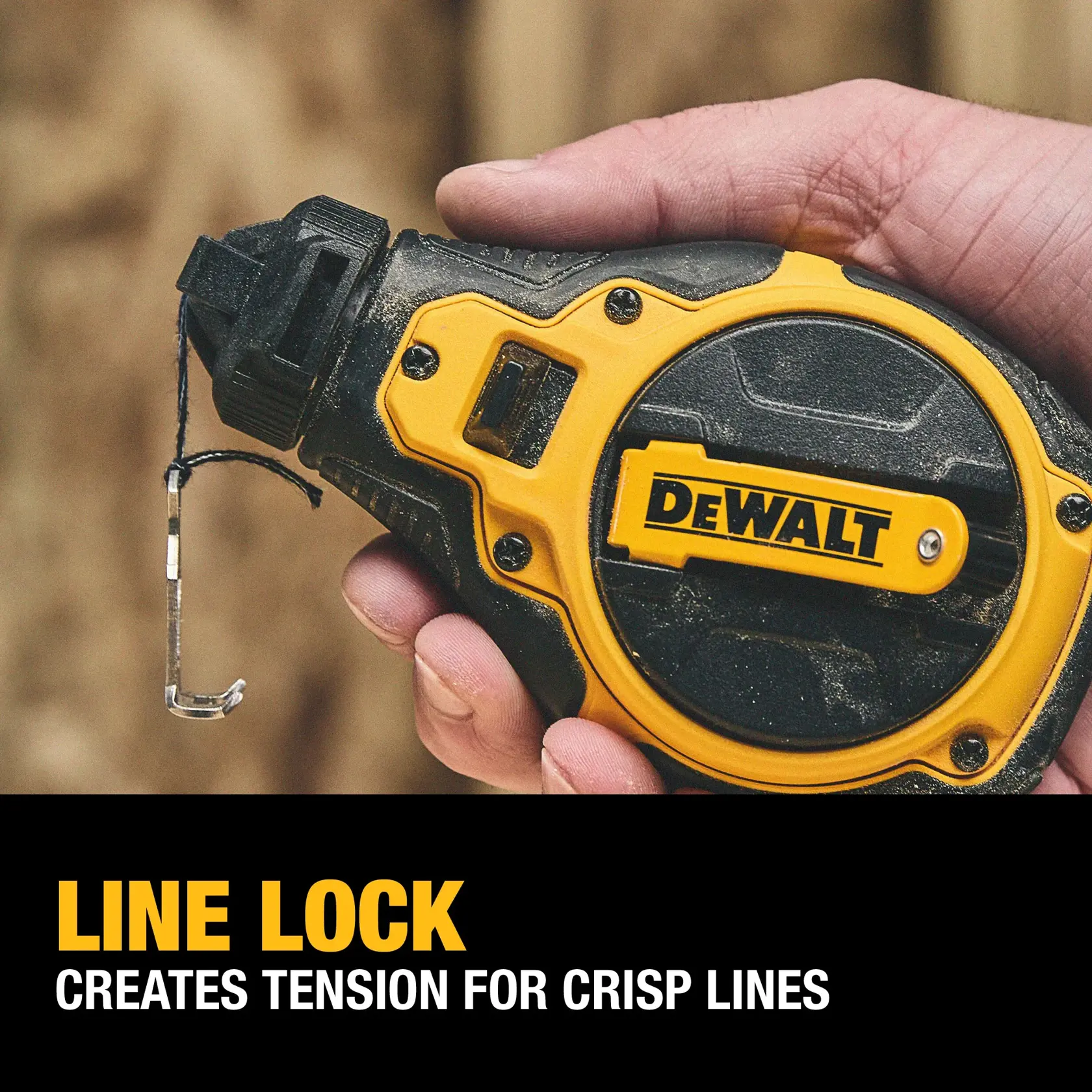 A hand holds a DEWALT chalk line tool, featuring a yellow and black design. The tool has a hook on the end of the line, and the text below reads: 'LINE LOCK Creates tension for crisp lines.'
