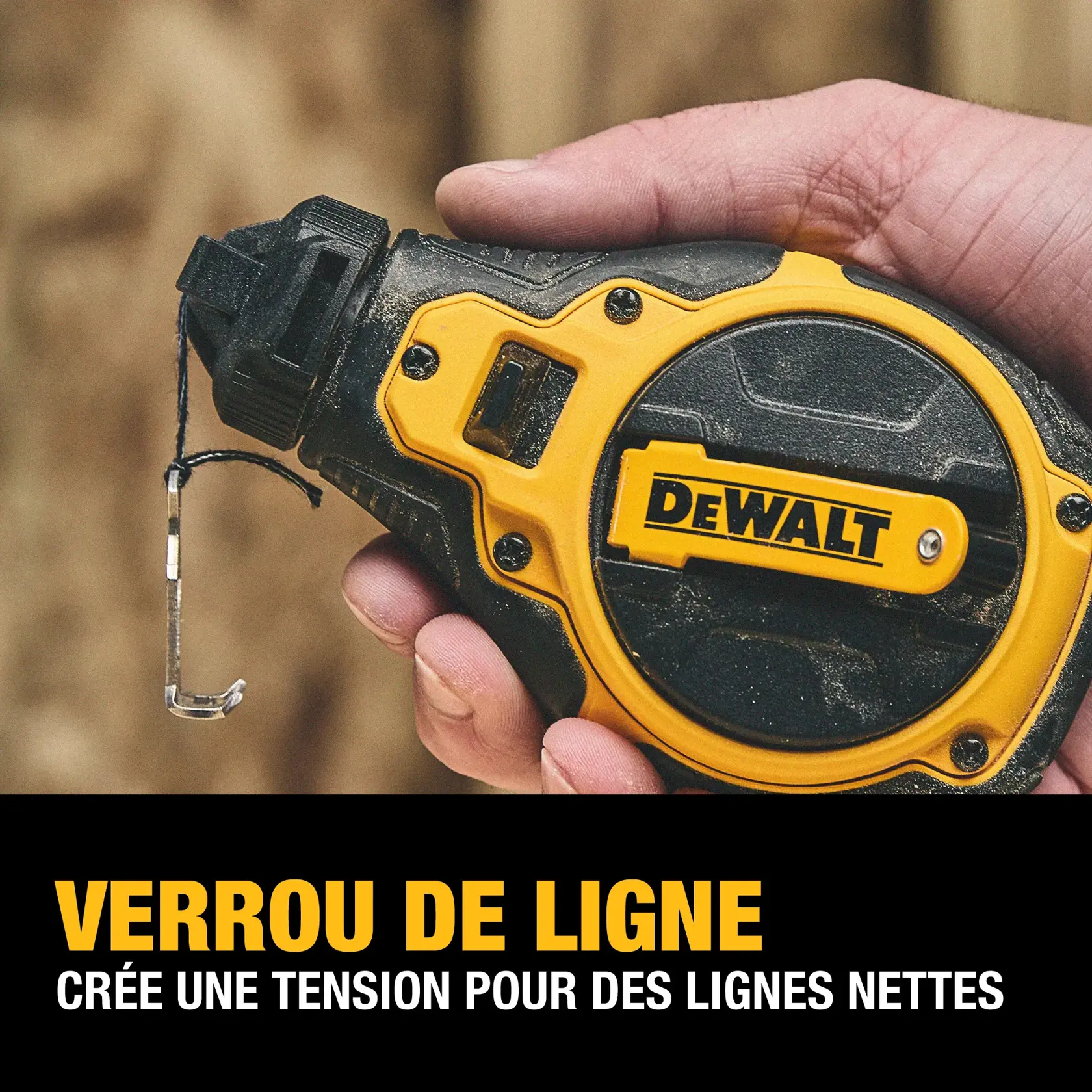 A hand holds a DEWALT chalk line tool, featuring a yellow and black design. The tool has a hook on the end of the line, and the text below reads: 'LINE LOCK Creates tension for crisp lines.'