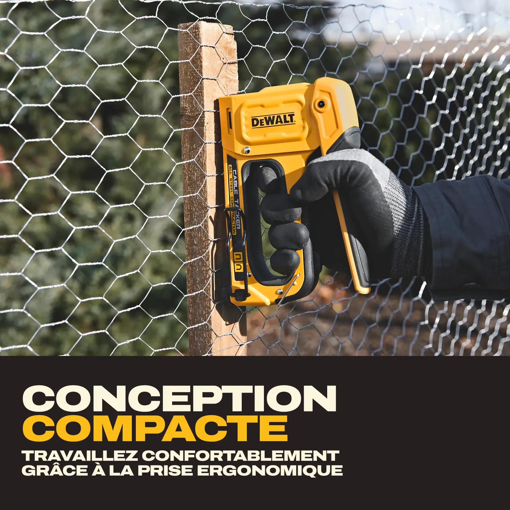 A person wearing gloves uses a yellow DEWALT staple gun (model DWHT70100) to attach wire mesh to a wooden post. The product is highlighted as having a compact design and an ergonomically designed grip for comfortable use.