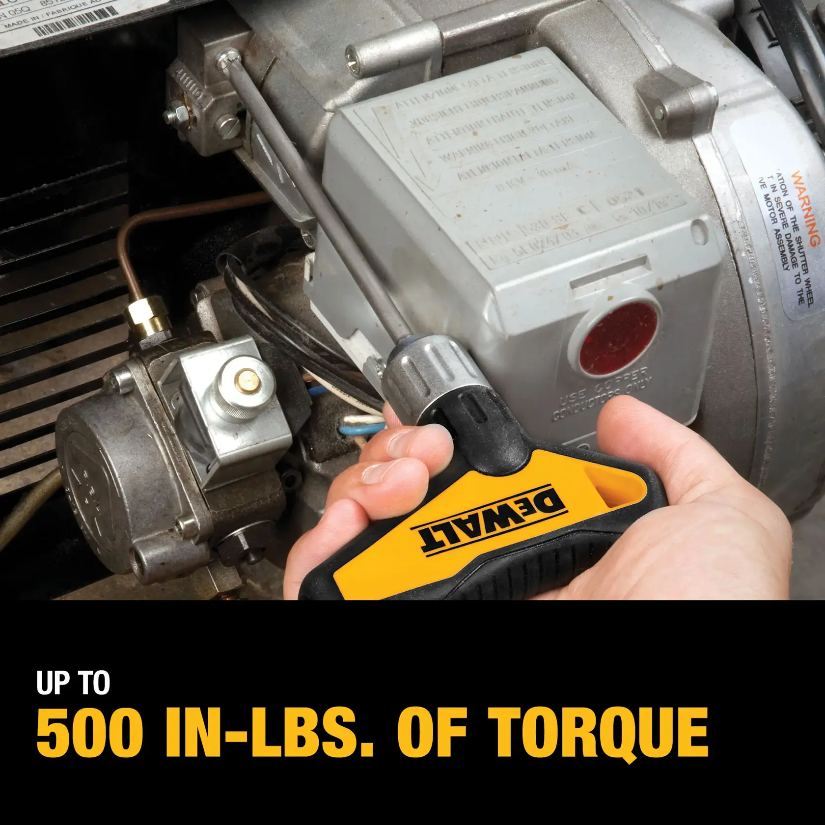 A hand using a DEWALT screwdriver to adjust a component on machinery, with a label indicating up to 500 inch-pounds of torque.
