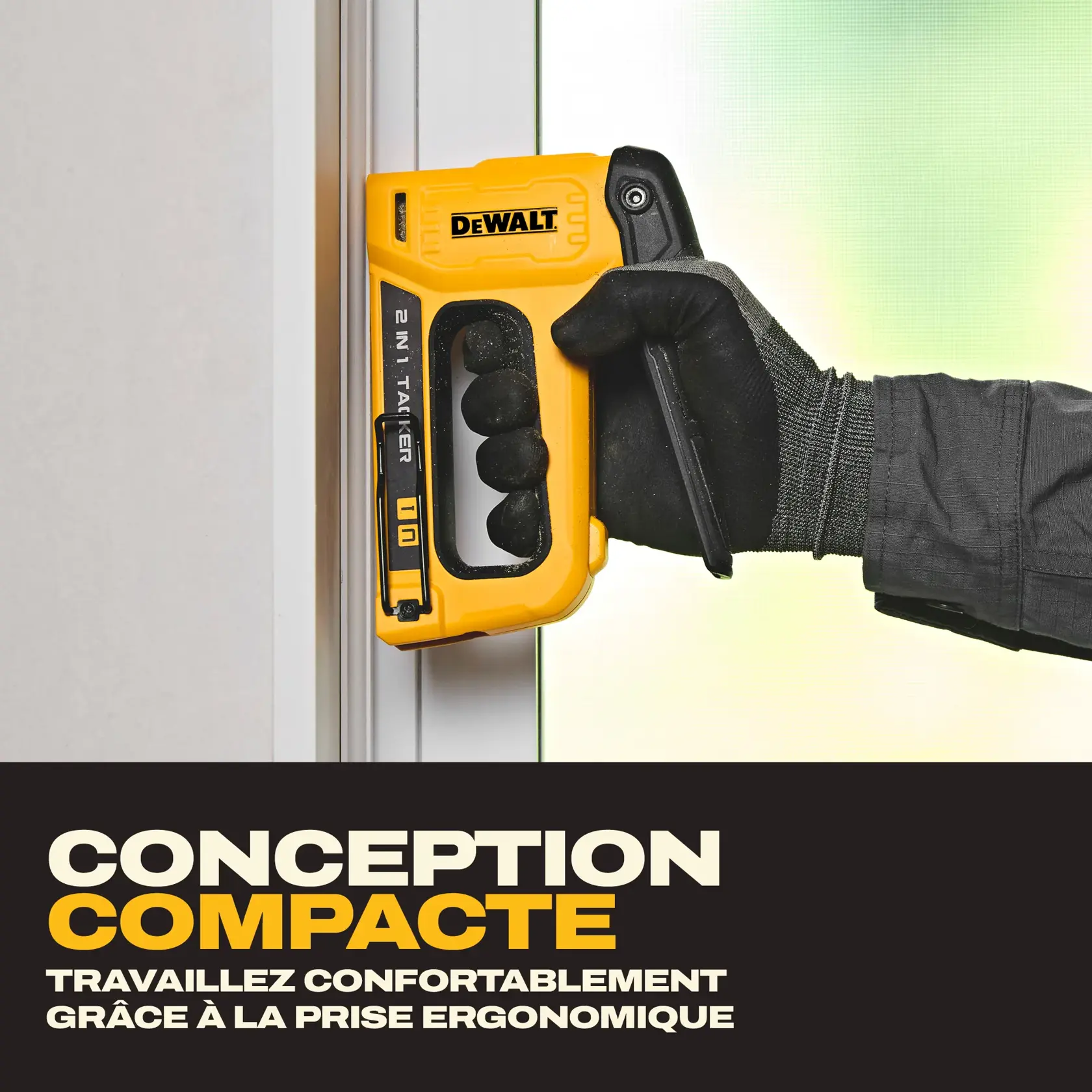 A person wearing a work glove holds a yellow DEWALT 2-in-1 stapler (model DWHT70350) against a vertical surface. The stapler features an ergonomic grip and the image text highlights its compact design for comfortable use.