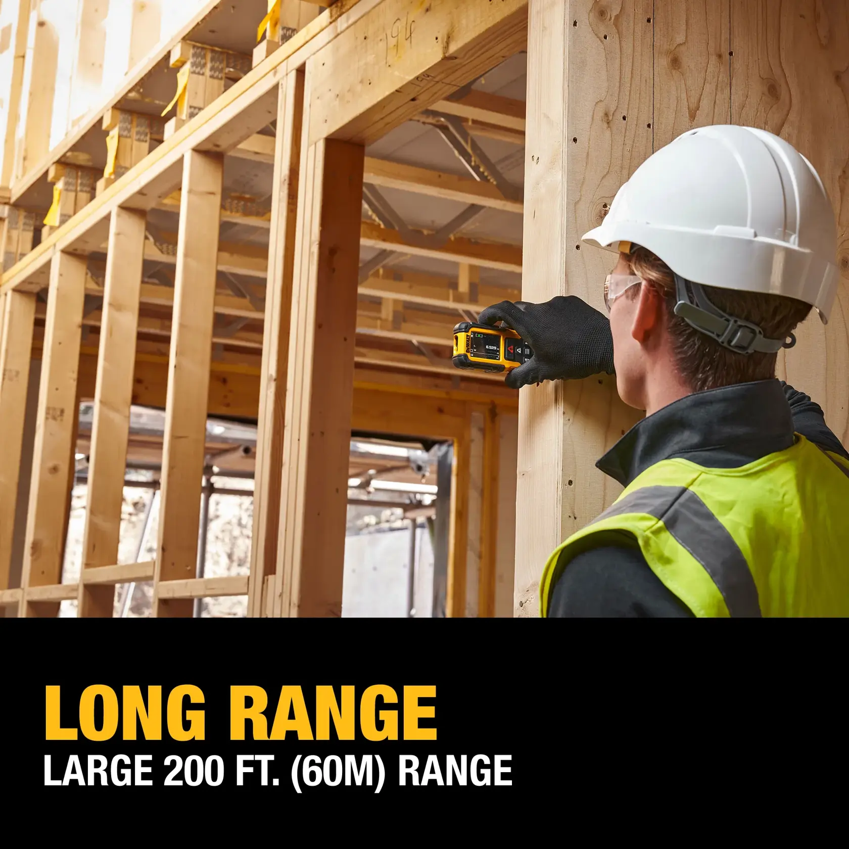 A person wearing a hard hat, safety vest, and gloves is using a DEWALT laser distance measurer on a wooden construction site. Text on the image reads: 'LONG RANGE. LARGE 200 FT. (60M) RANGE.'