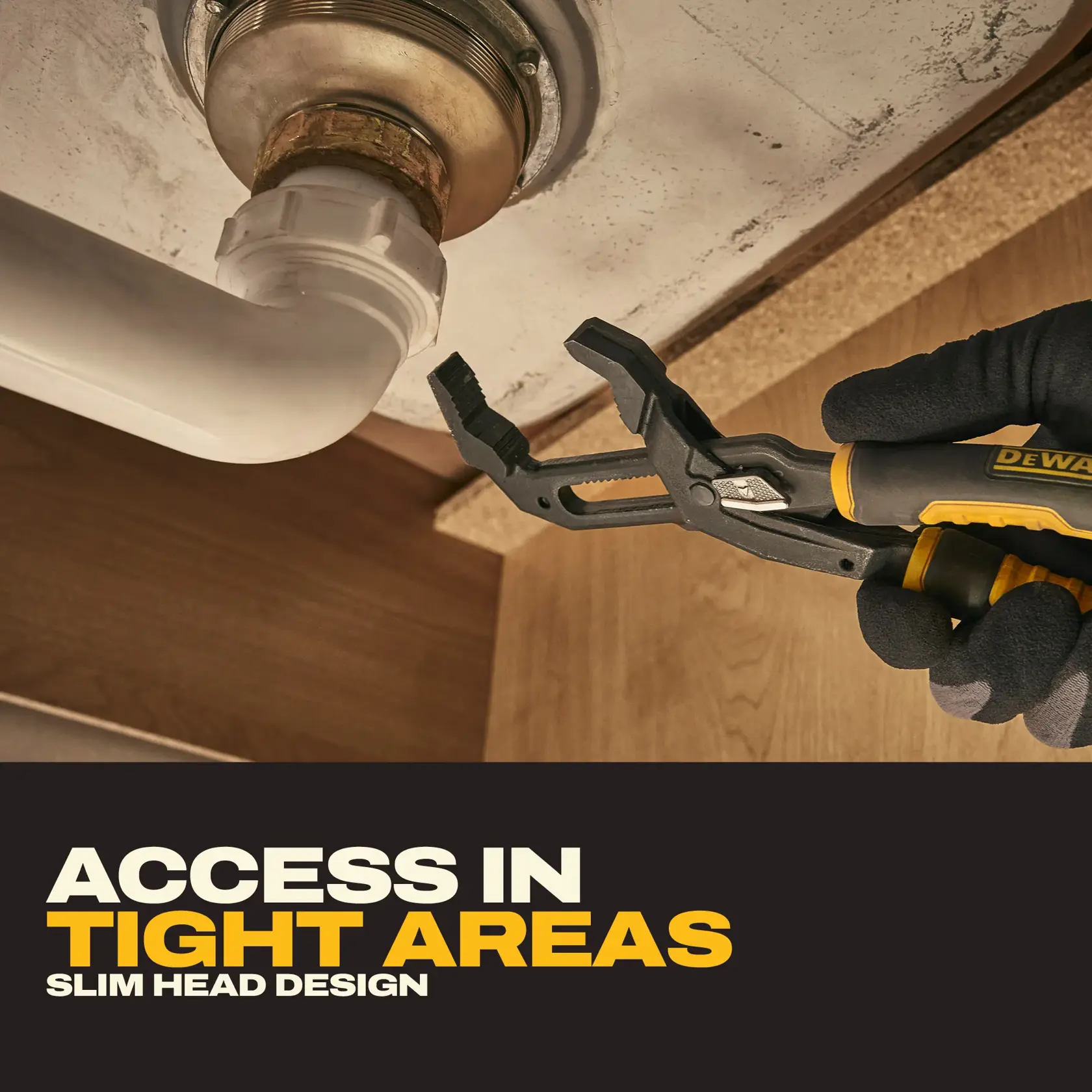A person wearing gloves is using a DEWALT slim head adjustable pliers to grip a pipe fitting under a sink, demonstrating access in tight areas. The image includes text that highlights the slim head design for working in confined spaces.