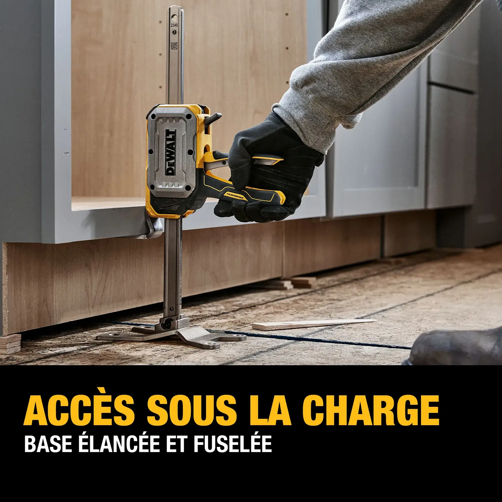 A DEWALT step-to-lift tool being used to lift a door hands-free using a reinforced handle, operated by a person’s foot. The tool is shown clamped to the base of the door, allowing for easy and hands-free lifting in a construction setting.