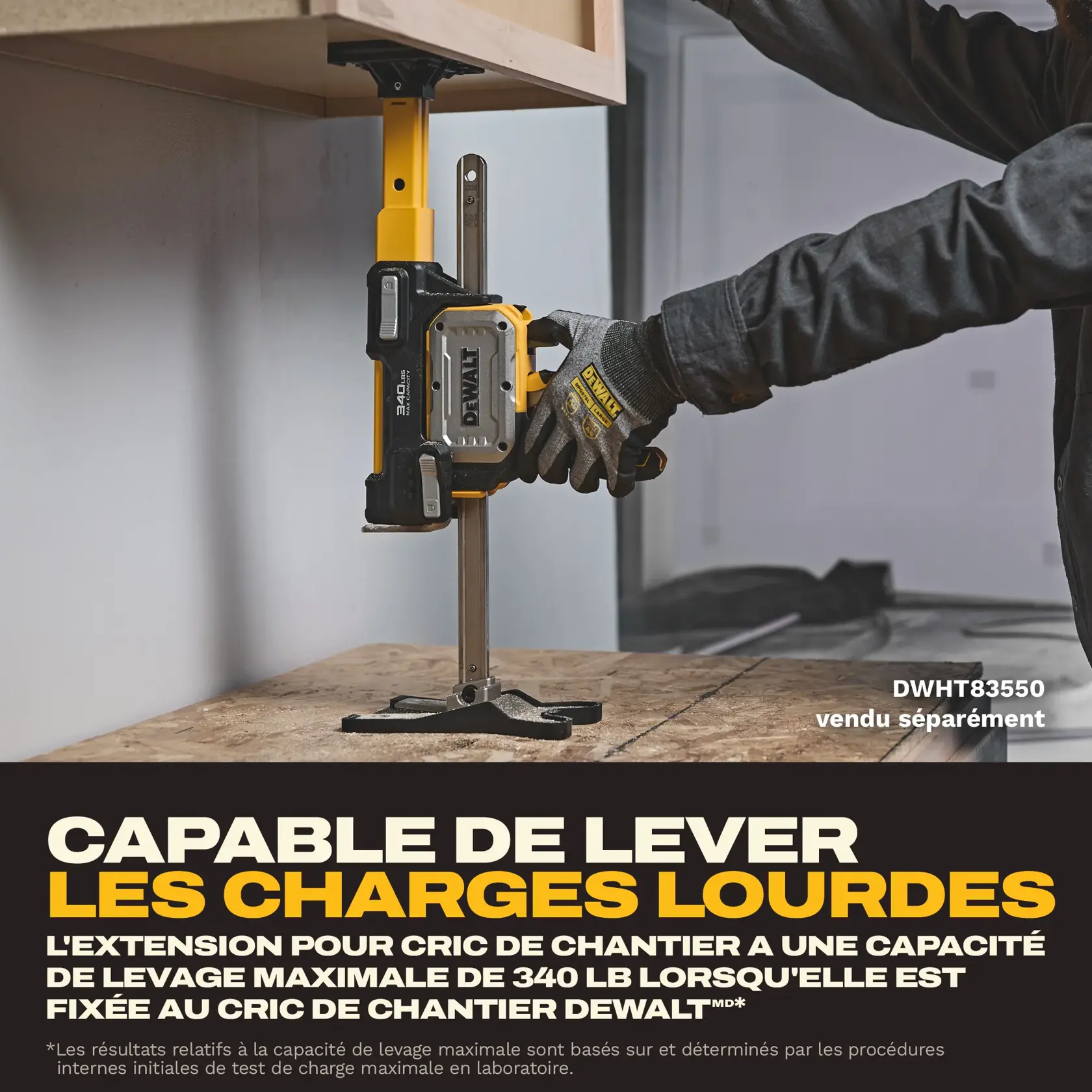 DEWALT construction jack is used to lift a cabinet. Gloved hand adjusts heavy duty tool for precise positioning.