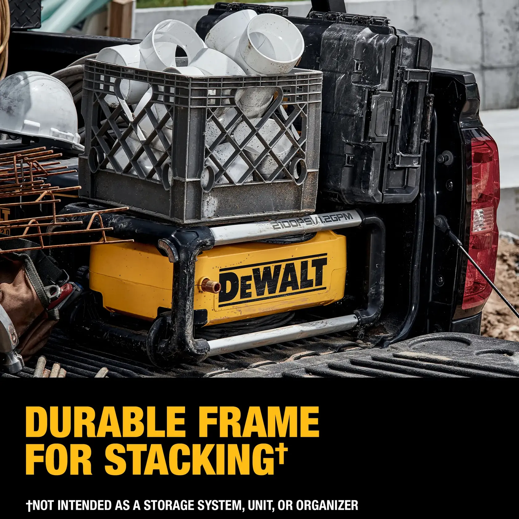 A DEWALT product with a durable frame is shown stacked in the bed of a truck, with a plastic crate filled with white PVC pipe fittings and a black case placed on top. Construction materials and a hard hat are also visible. The text emphasizes the frame's durability for stacking, noting it is not intended as a storage system, unit, or organizer.