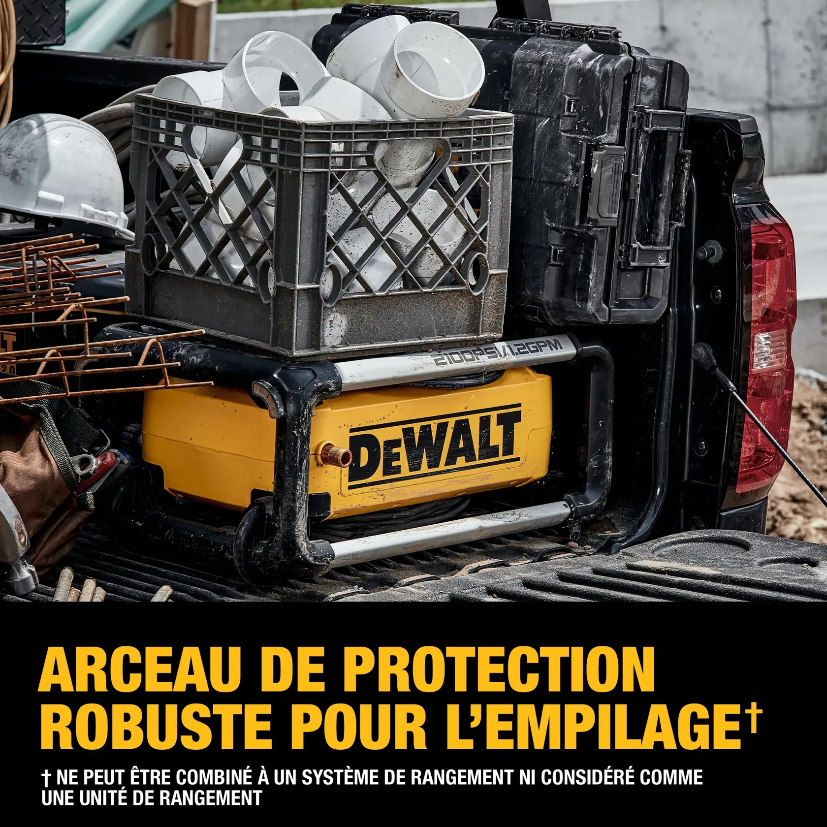 A DEWALT product with a durable frame is shown stacked in the bed of a truck, with a plastic crate filled with white PVC pipe fittings and a black case placed on top. Construction materials and a hard hat are also visible. The text emphasizes the frame's durability for stacking, noting it is not intended as a storage system, unit, or organizer.