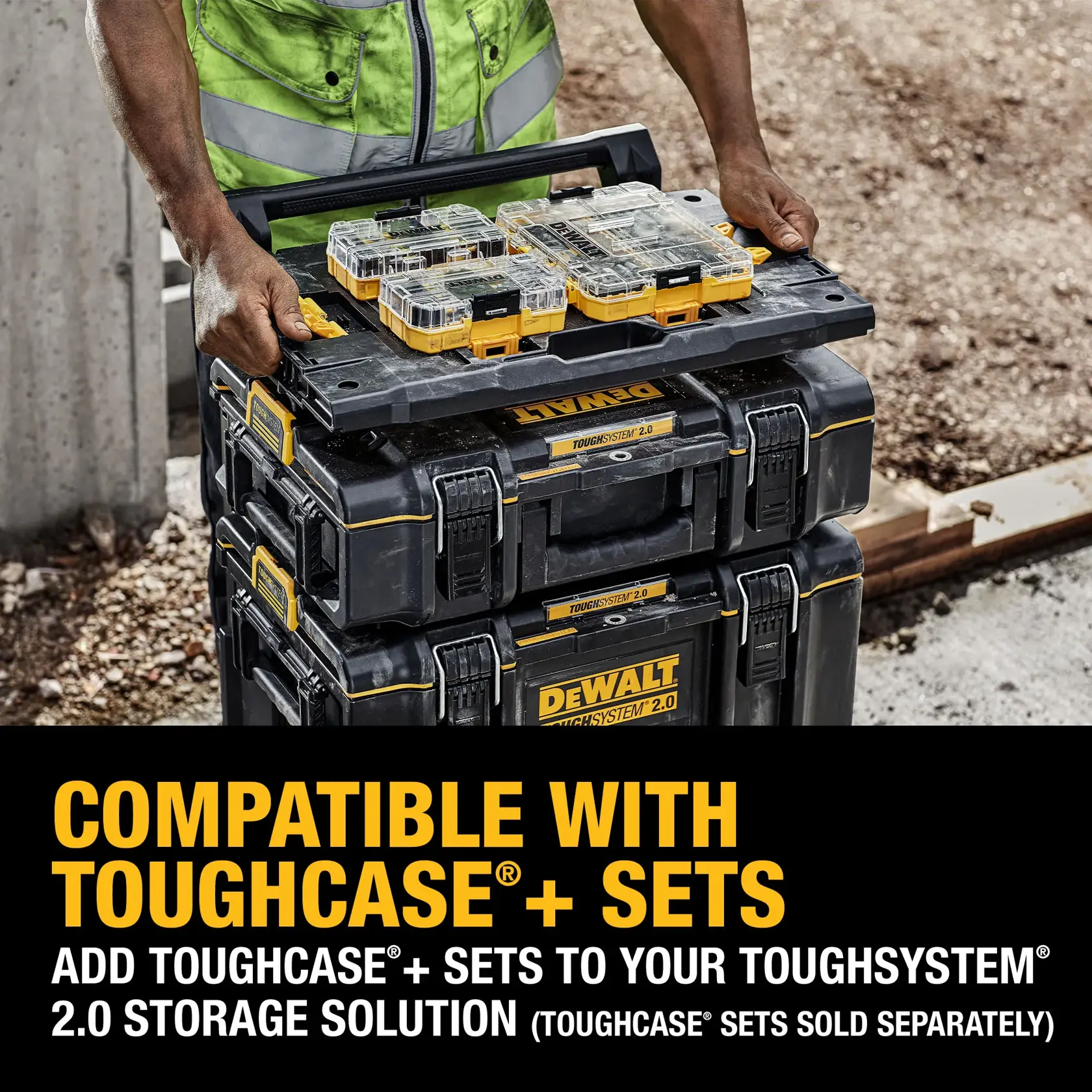 A person in a safety vest is stacking DEWALT ToughSystem 2.0 toolboxes and placing ToughCase+ sets on top. The text on the image states that these toolboxes are compatible with ToughCase+ sets and encourages adding them to the ToughSystem 2.0 storage solution.