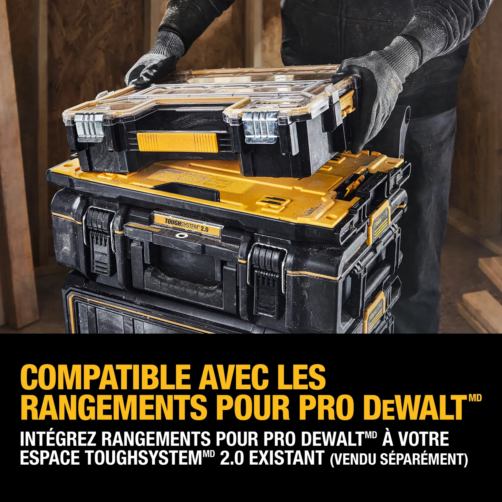A person connects a DEWALT TSTAK tool box to a stack of ToughSystem 2.0 storage modules. Text on the image states: 'TSTAK compatible. Connect your existing TSTAK modules to any ToughSystem 2.0 storage module (TSTAK and ToughSystem 2.0 units sold separately)'.