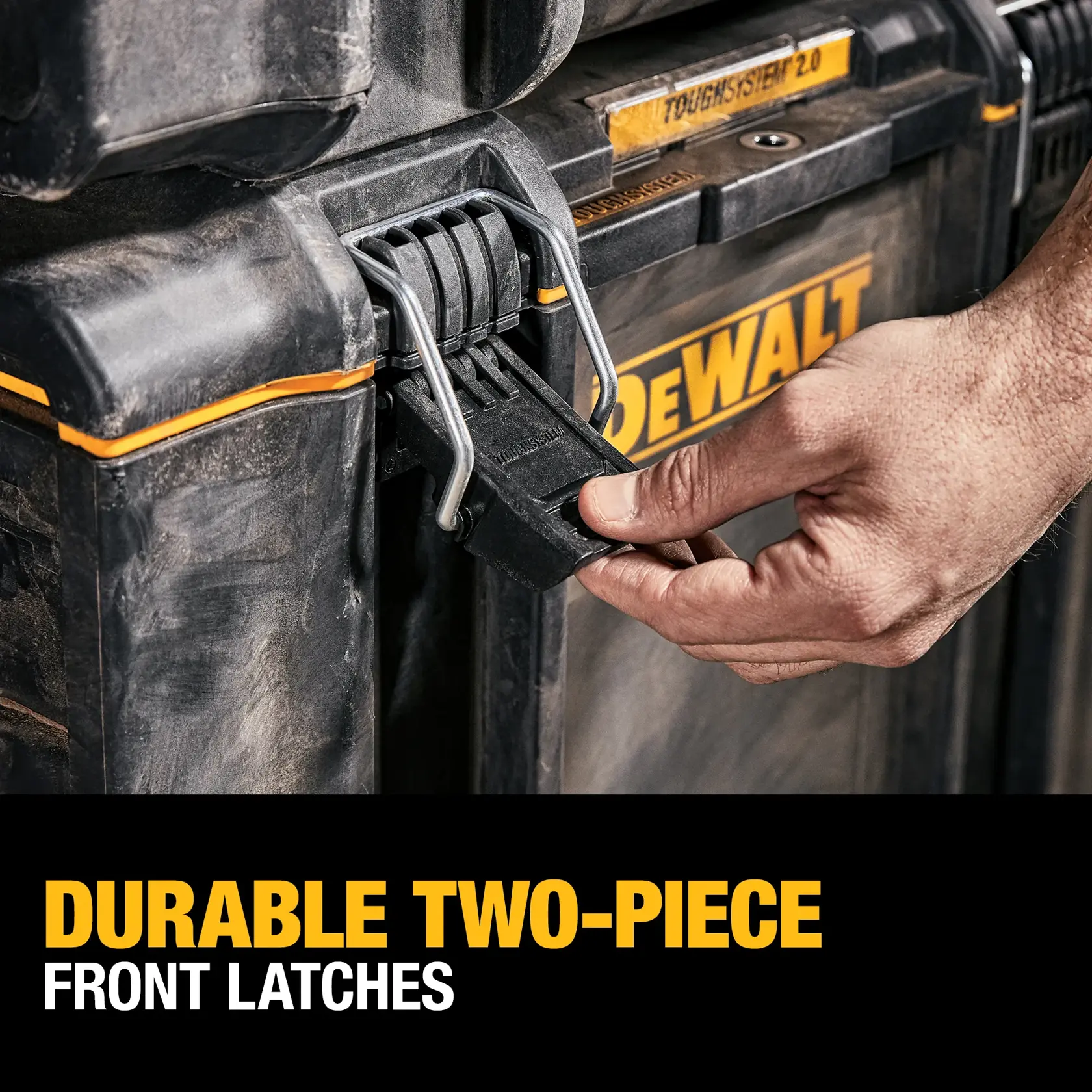 A person is holding the detachable back handle of a DEWALT rolling tool box with large wheels, on a construction site. The text says 'DETACHABLE BACK HANDLE'.