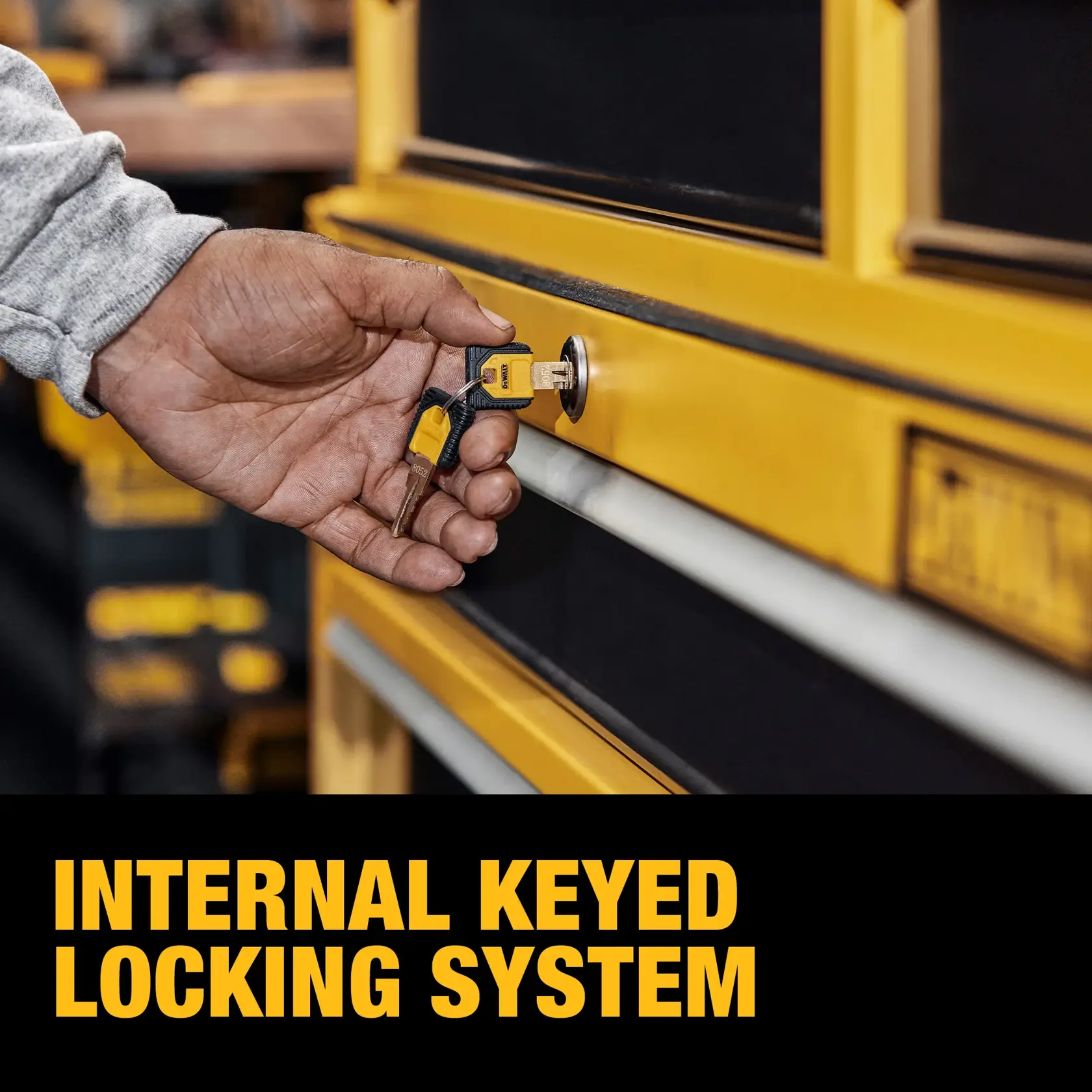 A hand is inserting a key into the lock of a yellow tool storage unit. The image includes text that reads 'Internal Keyed Locking System.'
