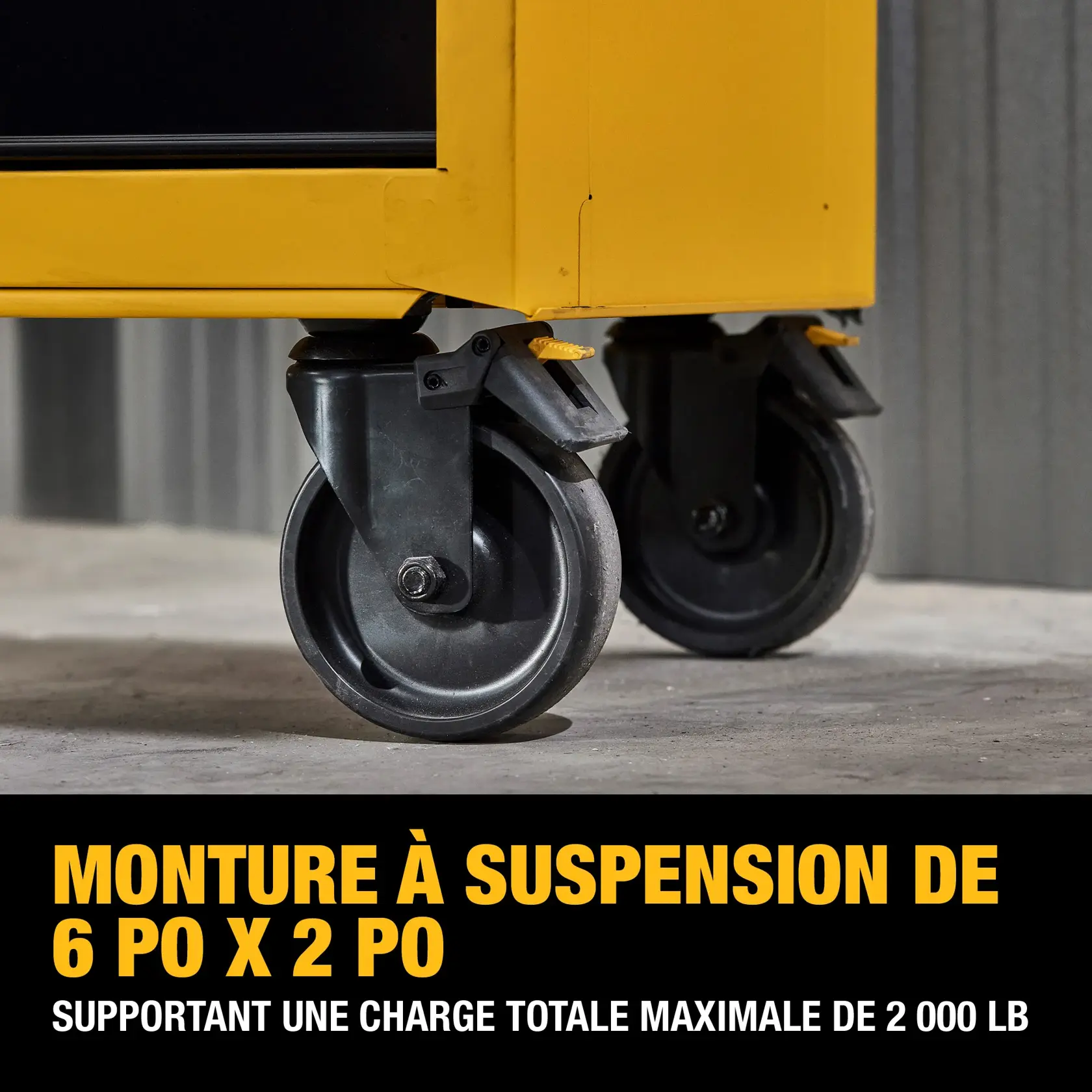 Close-up image of two heavy-duty 6 x 2 inch casters attached to the bottom of a yellow tool cabinet, with text indicating they support up to 2,000 lbs.