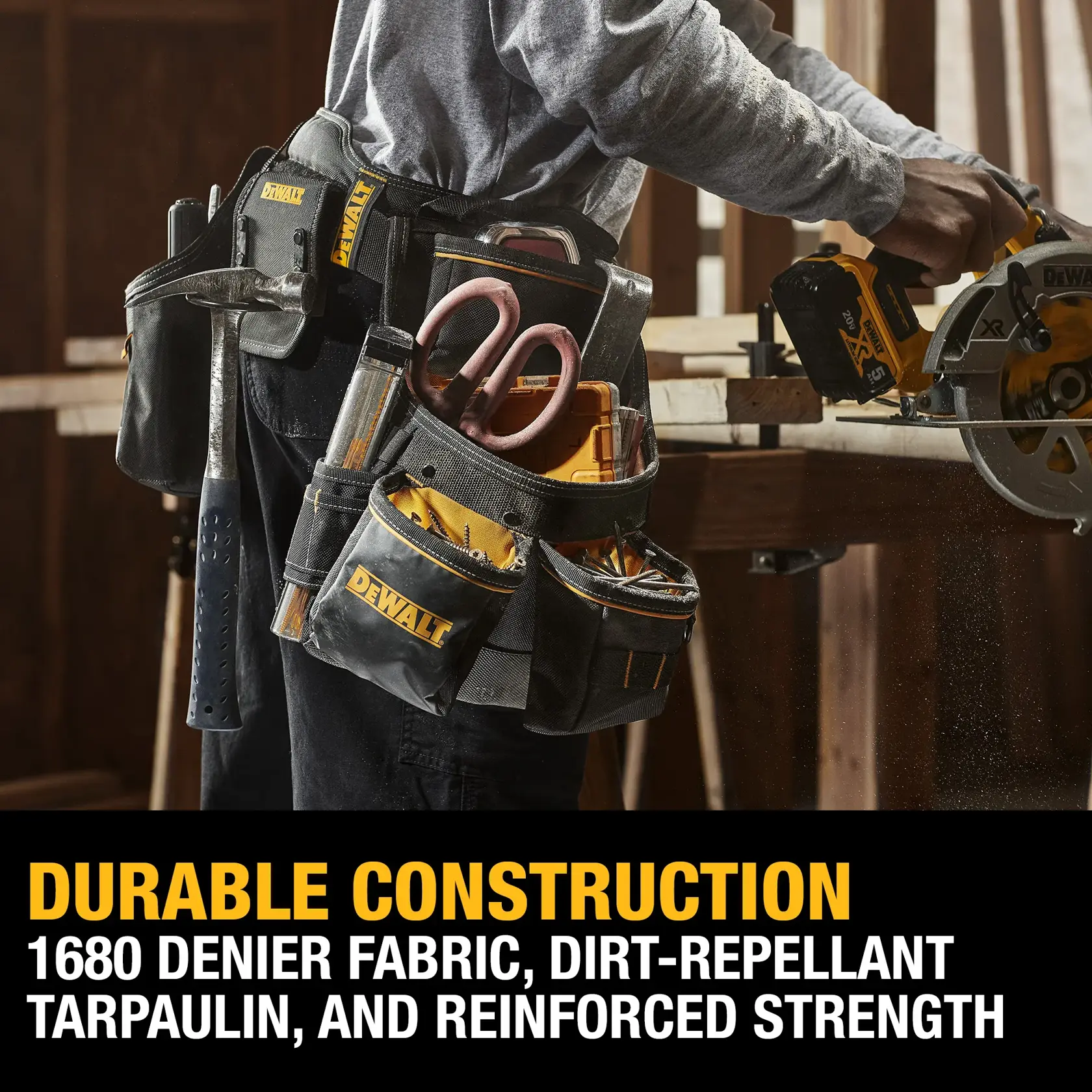 A person wearing a DEWALT tool belt filled with various tools, working with a DEWALT power saw in a woodworking environment. The image highlights the tool belt's durable construction featuring 1680 denier fabric, dirt-repellant tarpaulin, and reinforced strength.