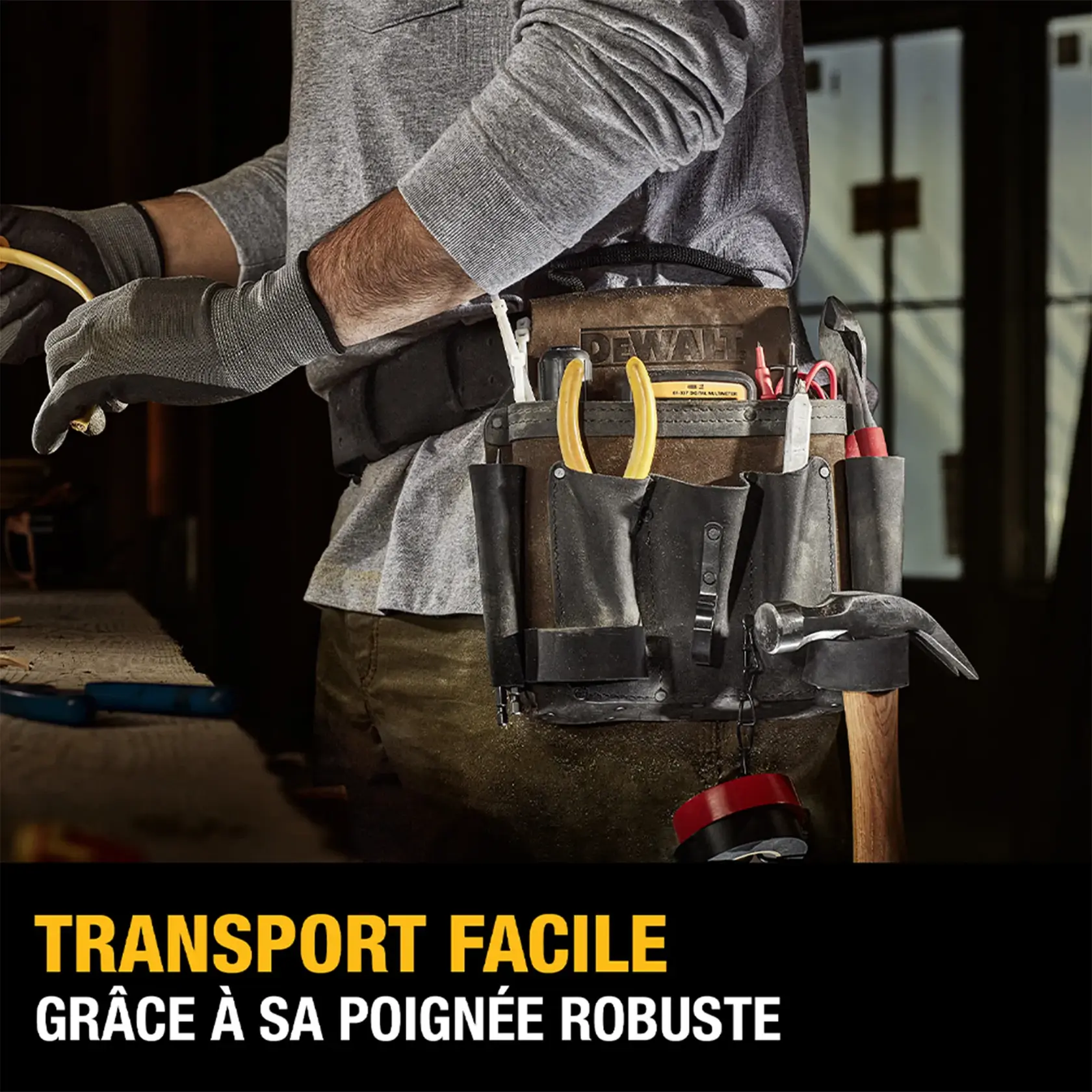 A person wearing a DEWALT tool belt loaded with various tools, including pliers, a hammer, screwdrivers, and measuring tape. The image highlights the tool belt's sturdy handle for easy transport. Text on the image reads: 'Seamless Transport. Utilizing the Sturdy Handle.'