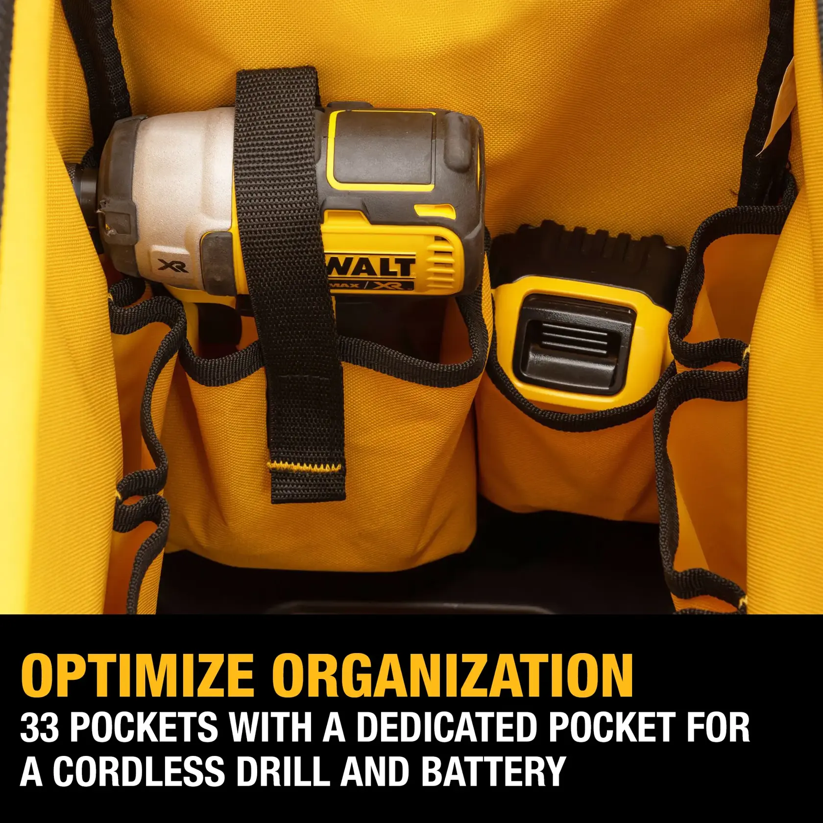 Close-up of a DEWALT tool bag showing dedicated pockets for a cordless drill and battery, with text stating the bag has 33 pockets for optimized organization.