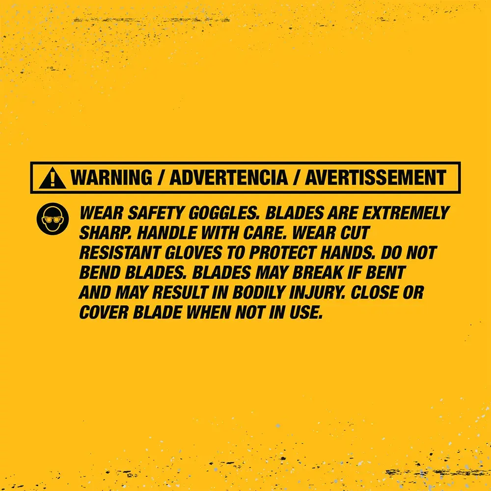 A yellow warning label with black text for DEWALT. The label states: 'WARNING / ADVERTENCIA / AVERTISSEMENT. Wear safety goggles. Blades are extremely sharp. Handle with care. Wear cut resistant gloves to protect hands. Do not bend blades. Blades may break if bent and may result in bodily injury. Close or cover blade when not in use.'