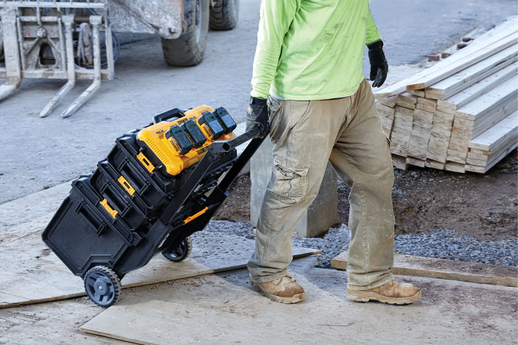 A yellow DEWALT DCB104 battery charger featuring four charging ports for simultaneous charging, 8 amp output per port, ToolConnect tag ready, mounts on ToughSystem rails, and thru-hole wall mounts. The charger is designed for 20V MAX batteries.