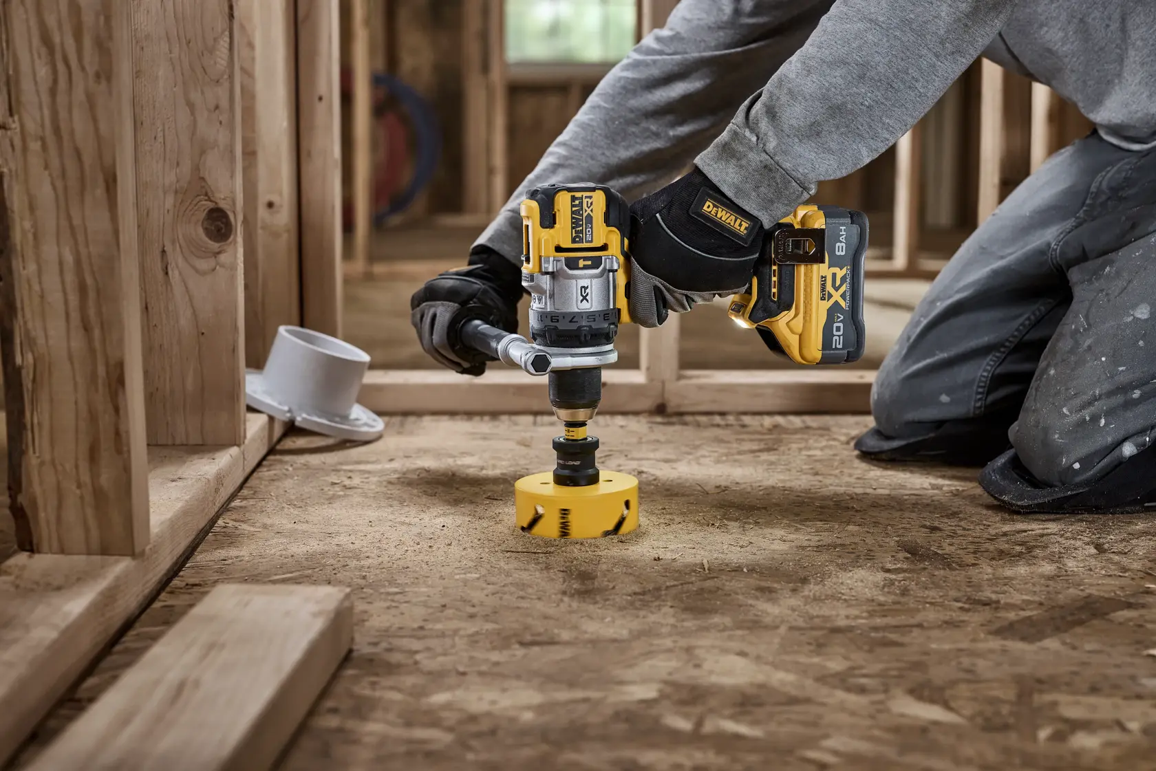 A DEWALT battery and charger are shown inside a large yellow circle with a diagonal line across them, indicating they are not included. Text below reads: 'Battery and charger sold separately.'