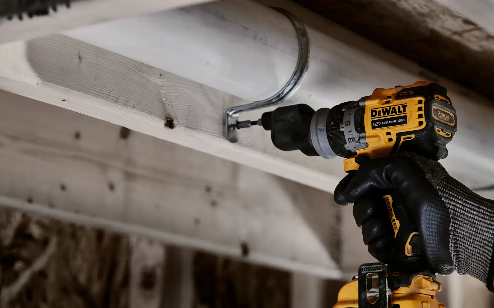 DEWALT drill with high speed transmission and 2-speed settings for 0-425 or 0-1,500 RPM, shown on wood surface.