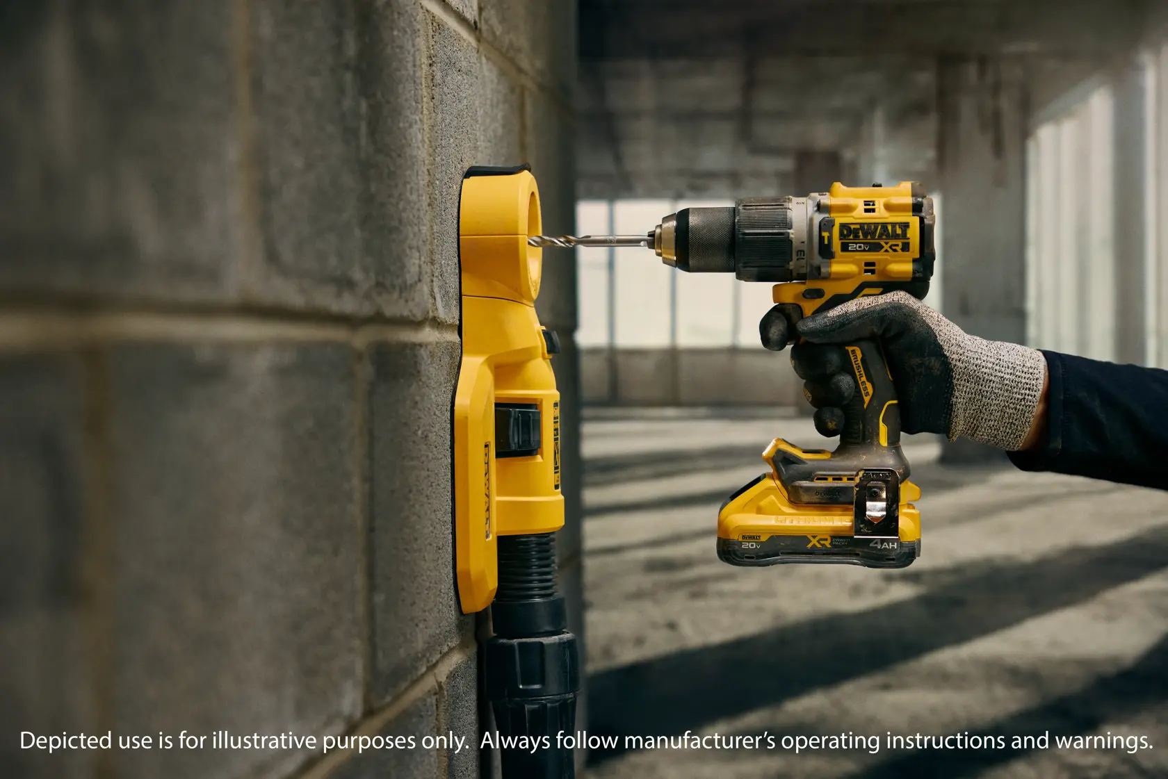 A person using a DEWALT DCD806D2 cordless drill to drill into a concrete wall, with a yellow dust extraction attachment connected to the drill and wall for cleaner operation. The person is wearing a work glove and the scene takes place in an unfinished building.