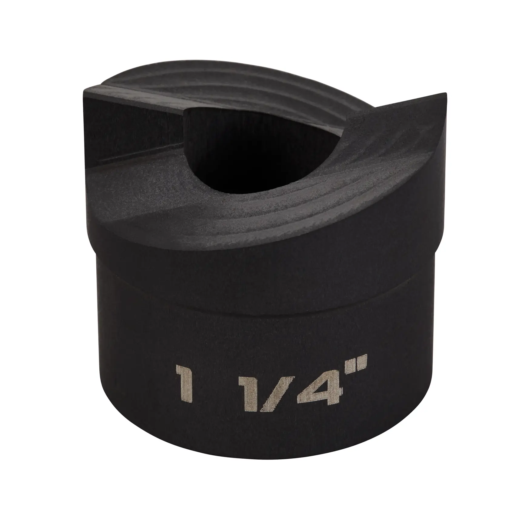 A close-up photo of a black DEWALT tool accessory, cylindrical in shape, with an engraved marking reading '1 1/4 inch' on its side. The accessory has a hollowed-out interior and a notched opening at the top.