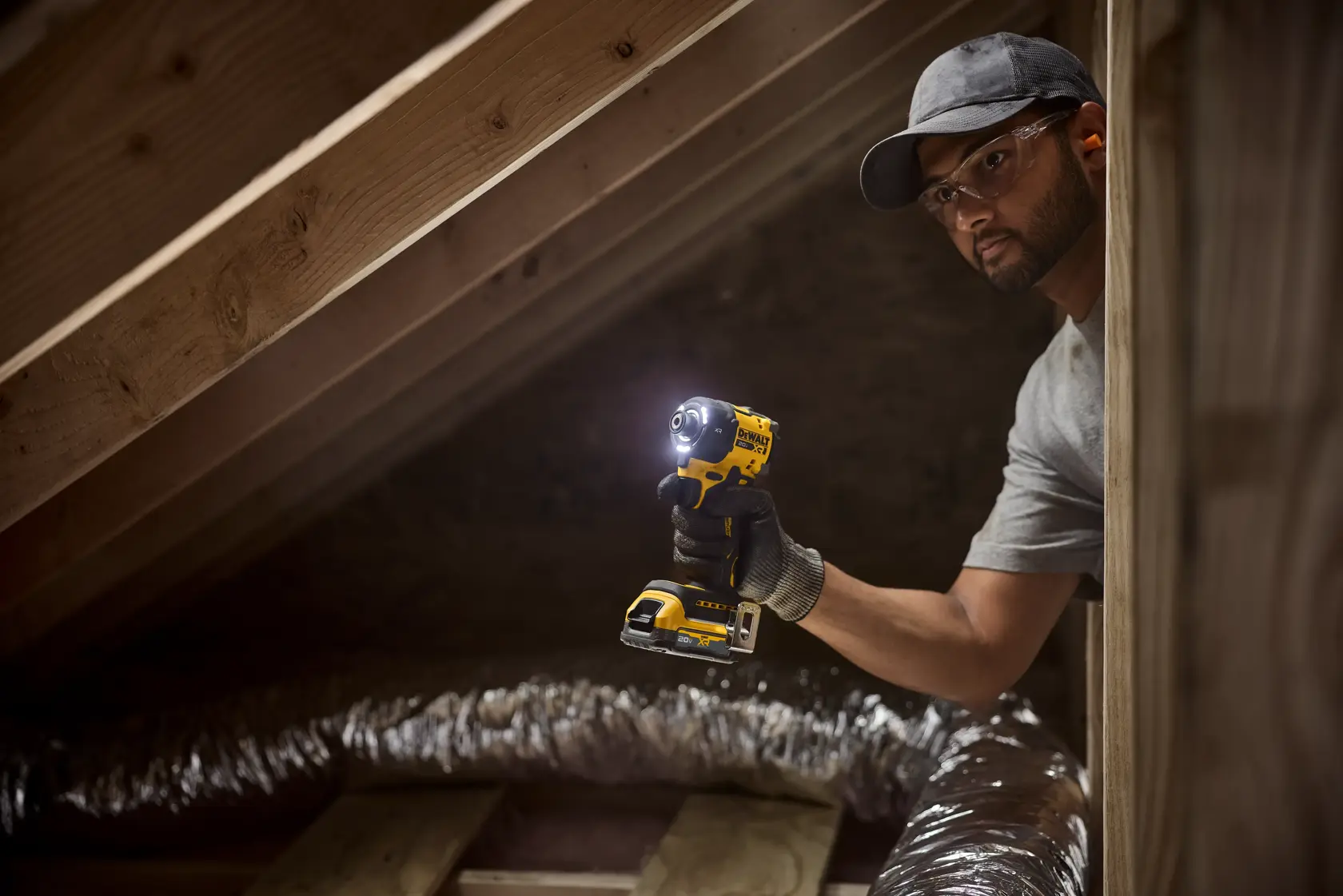 A DEWALT battery and charger are shown inside a large yellow circle with a diagonal line across them, indicating they are not included. Text below reads: 'Battery and charger sold separately.'