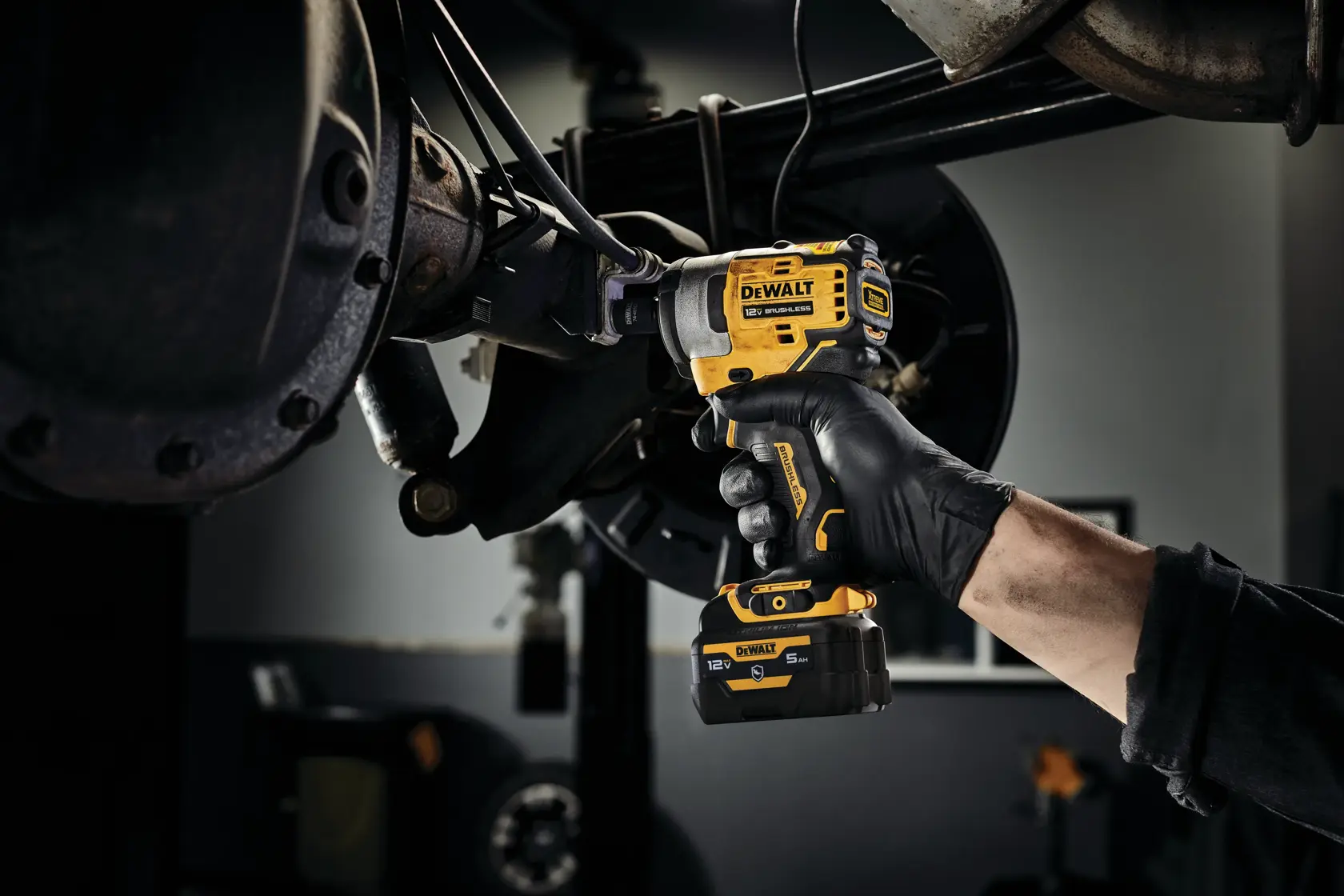 CORDLESS IMPACT WRENCH with battery stand in action