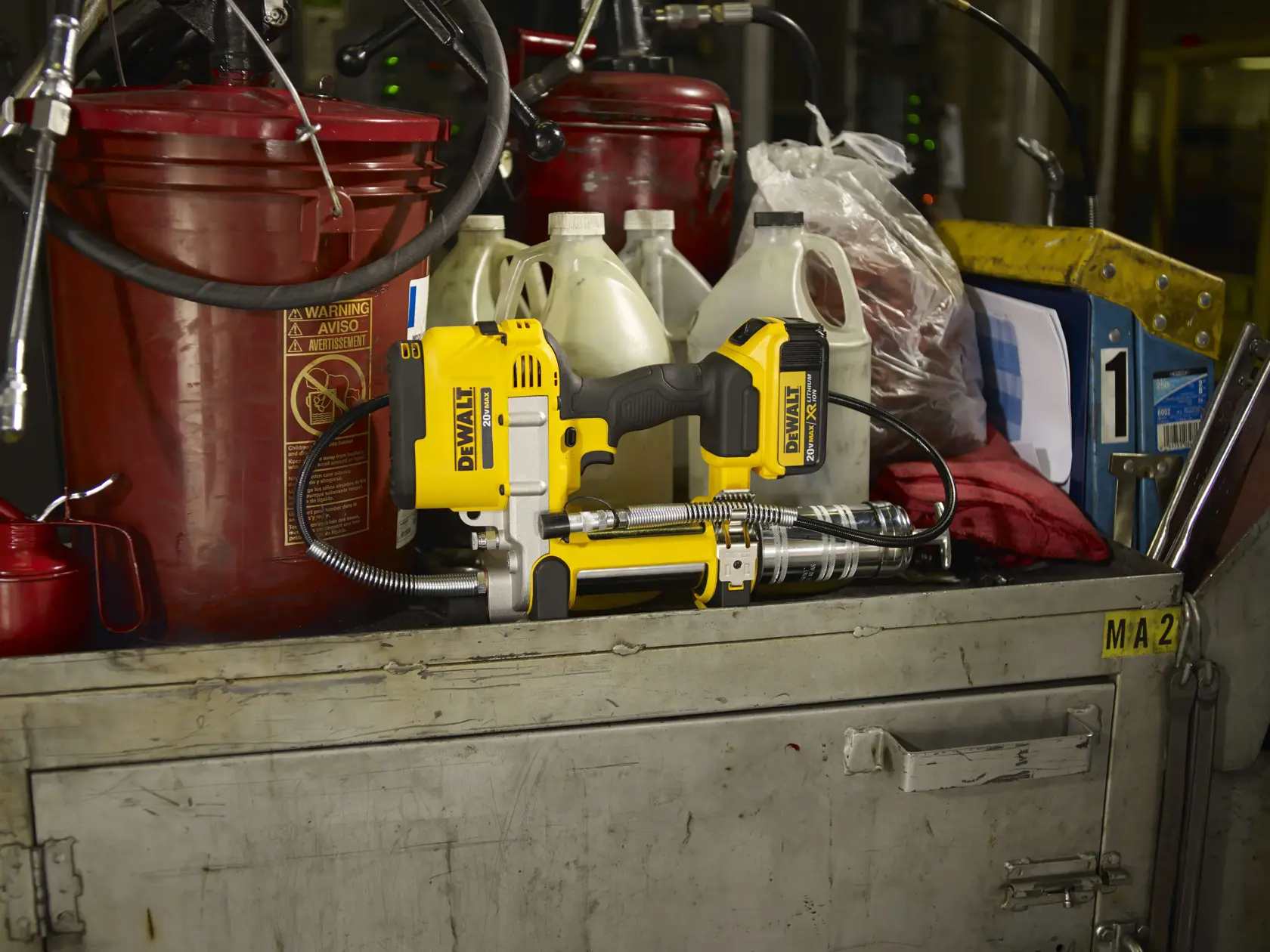 Grease gun being placed on shelf