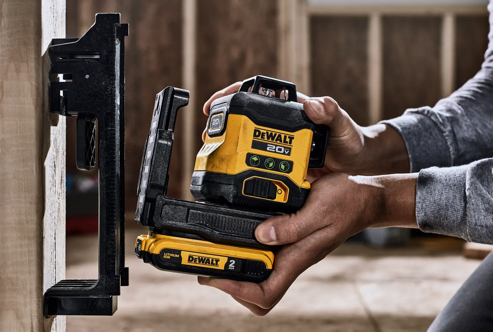 A DEWALT battery and charger are shown inside a large yellow circle with a diagonal line across them, indicating they are not included. Text below reads: 'Battery and charger sold separately.'