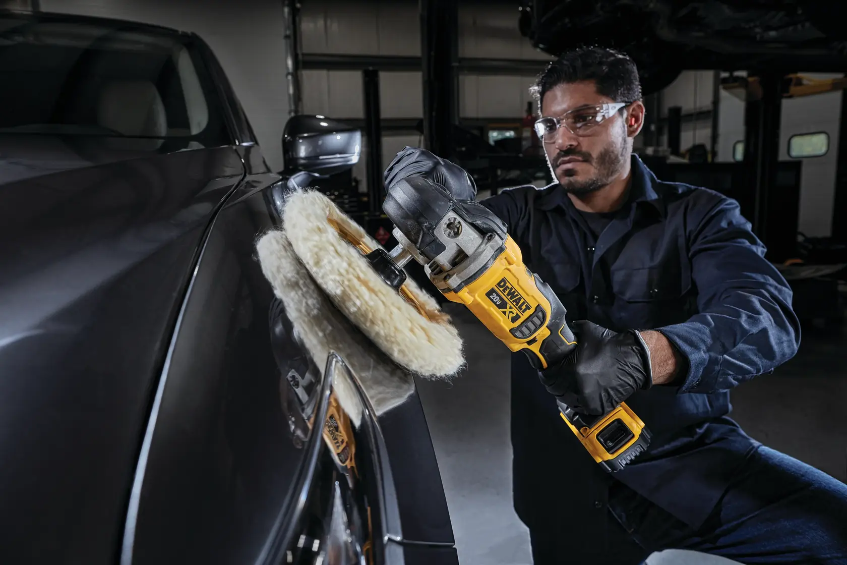 Close-up image of a DEWALT power tool showing a sideways battery pack, with highlighted text stating that the sideways battery pack helps prevent surface scratching while working.