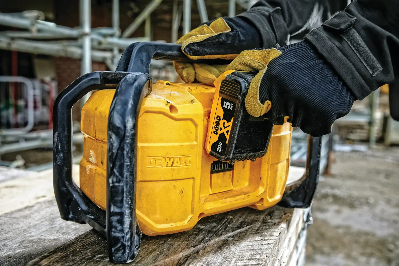 Image of a DEWALT portable radio with handle, featuring AM/FM radio, adjustable speaker tone, 6 radio presets, compact and lightweight design, and premium quad speaker design. The radio is compatible with 12V, 20V, and FLEXVOLT batteries.