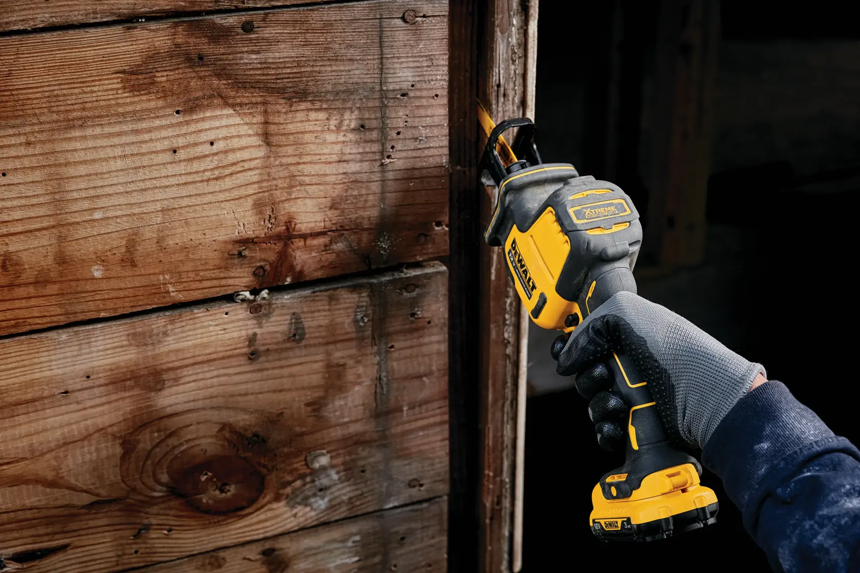 A DEWALT 12V brushless reciprocating saw with a tool-free blade release, bright LED light, and variable-speed trigger. The saw is black and yellow with brushless motor technology.