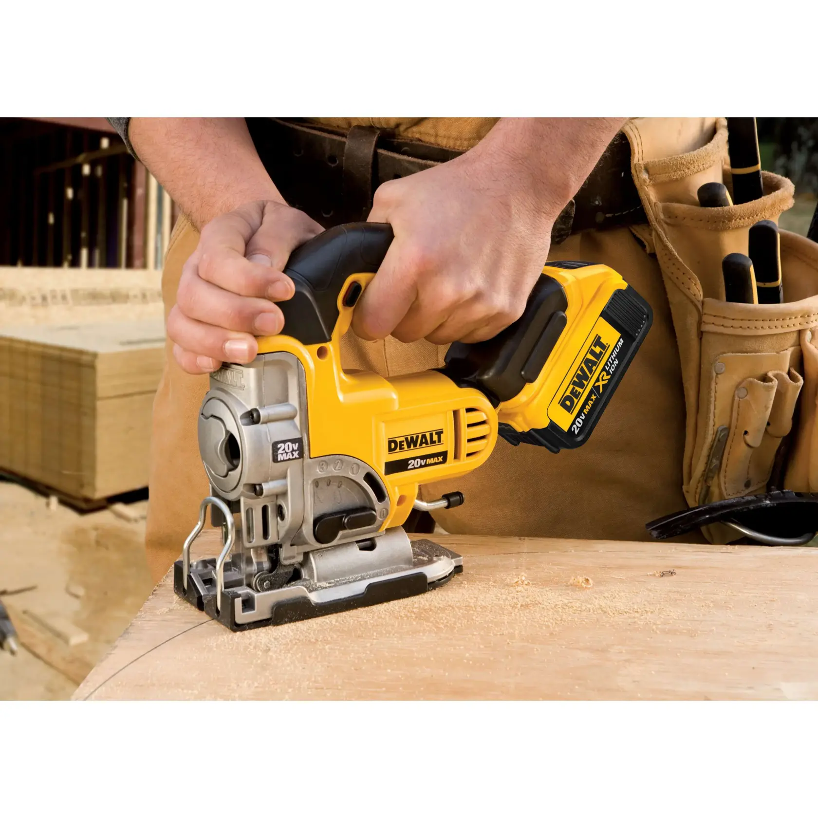 A DEWALT cordless jigsaw being used to cut a piece of wood, featuring a 20V MAX lithium battery. The lower section highlights its anti-slip comfort grip designed to help reduce hand fatigue. Text indicates battery is sold separately.