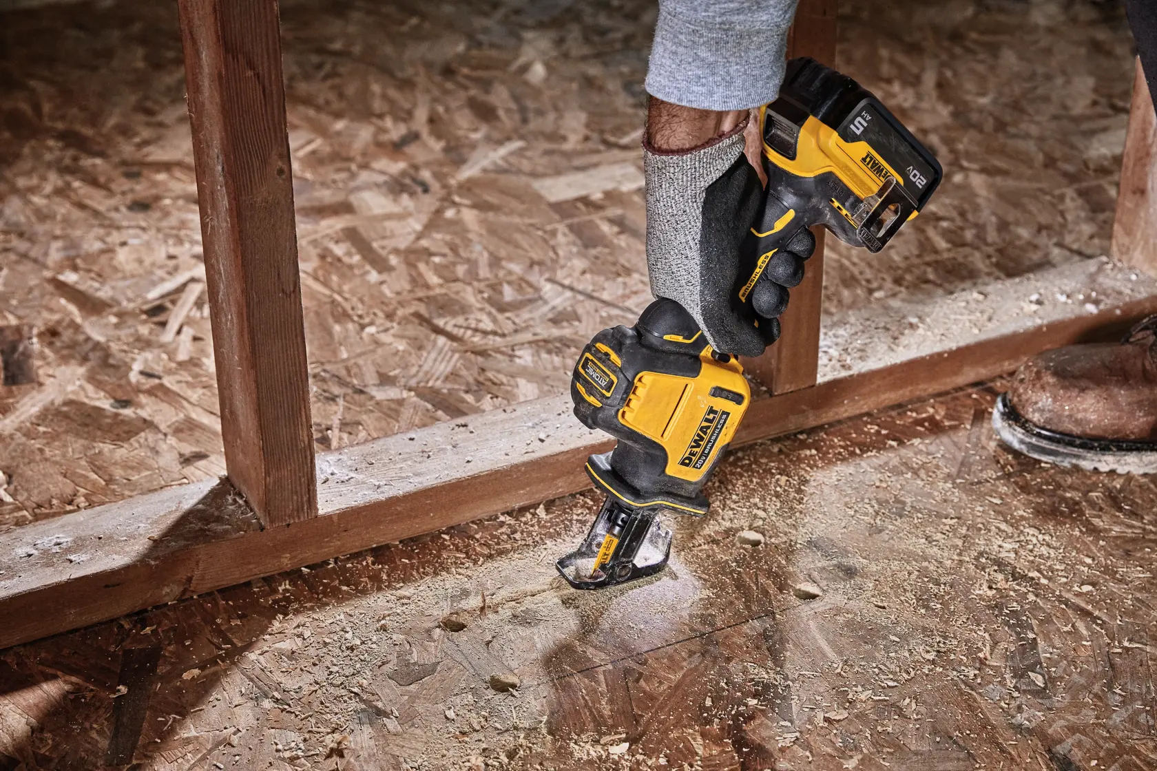 Close-up of a DEWALT 20V cordless reciprocating saw showing the pivoting shoe feature, with the words 'PIVOTING SHOE' highlighted in a yellow box below.