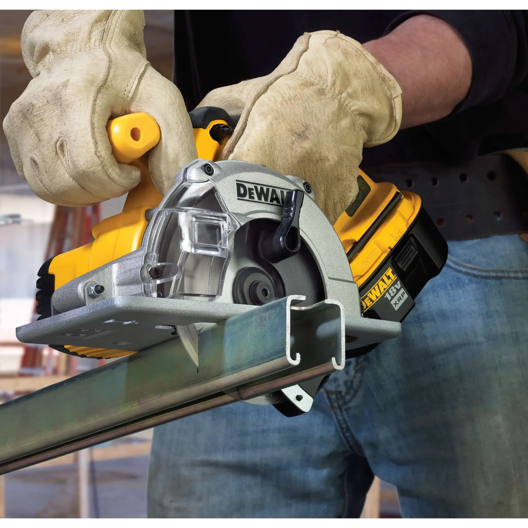 Person wearing gloves operating a DEWALT cordless circular saw to cut a metal beam.