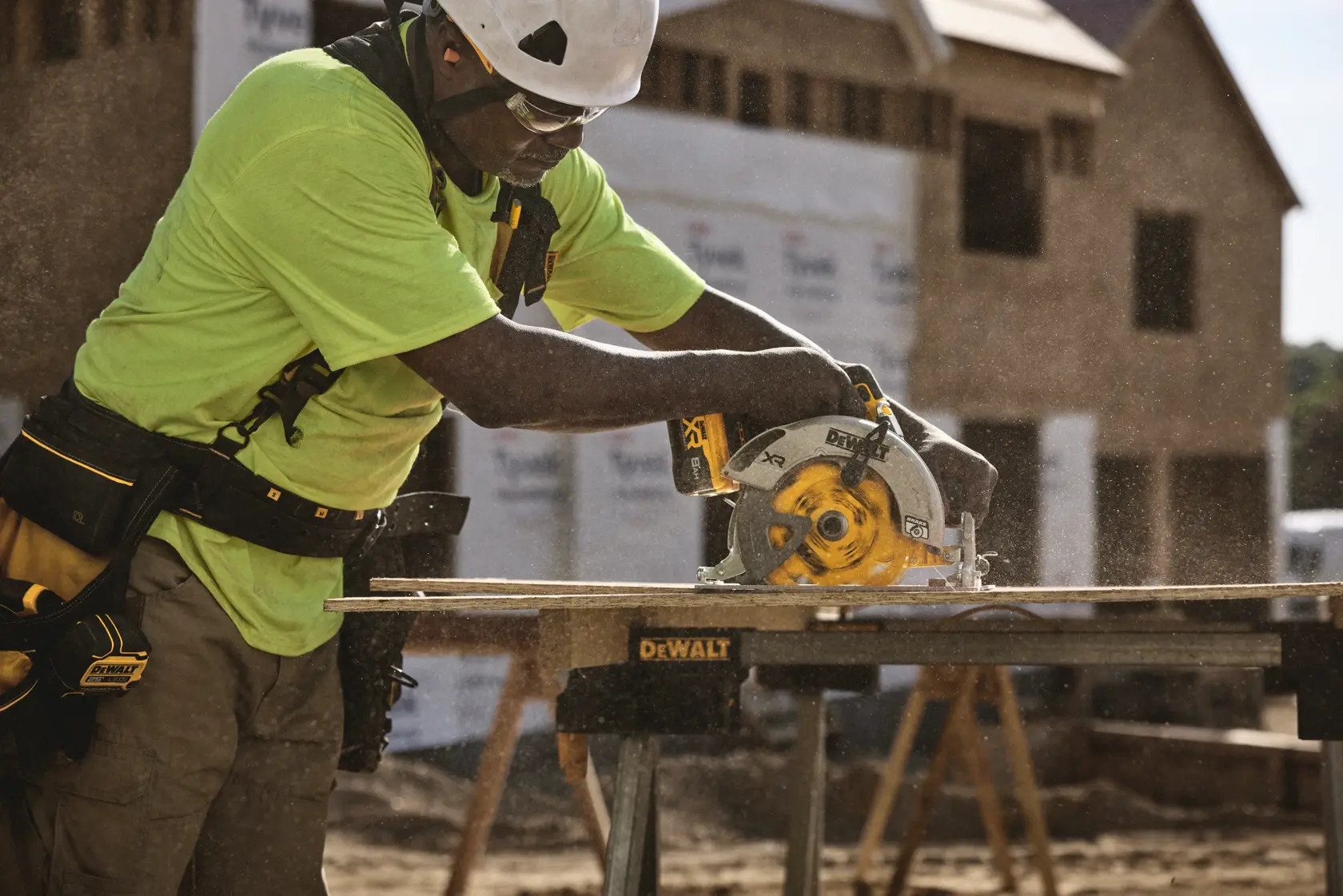 A DEWALT battery and charger are shown inside a large yellow circle with a diagonal line across them, indicating they are not included. Text below reads: 'Battery and charger sold separately.'