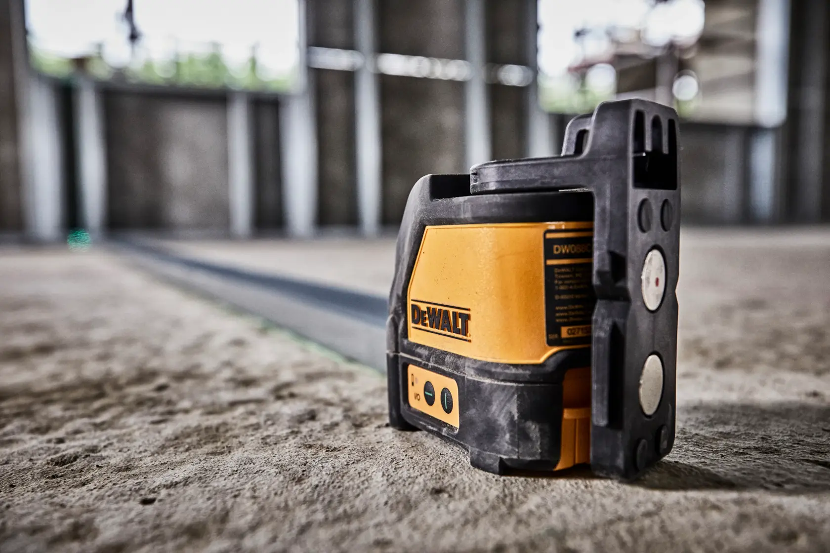 Square yellow DEWALT graphic showing range information: 'RANGE 100 / 165 ft** 30M / 50M with detector**'. Small text notes that range of up to 165 feet is possible when used with detector model DW0892G, sold separately.