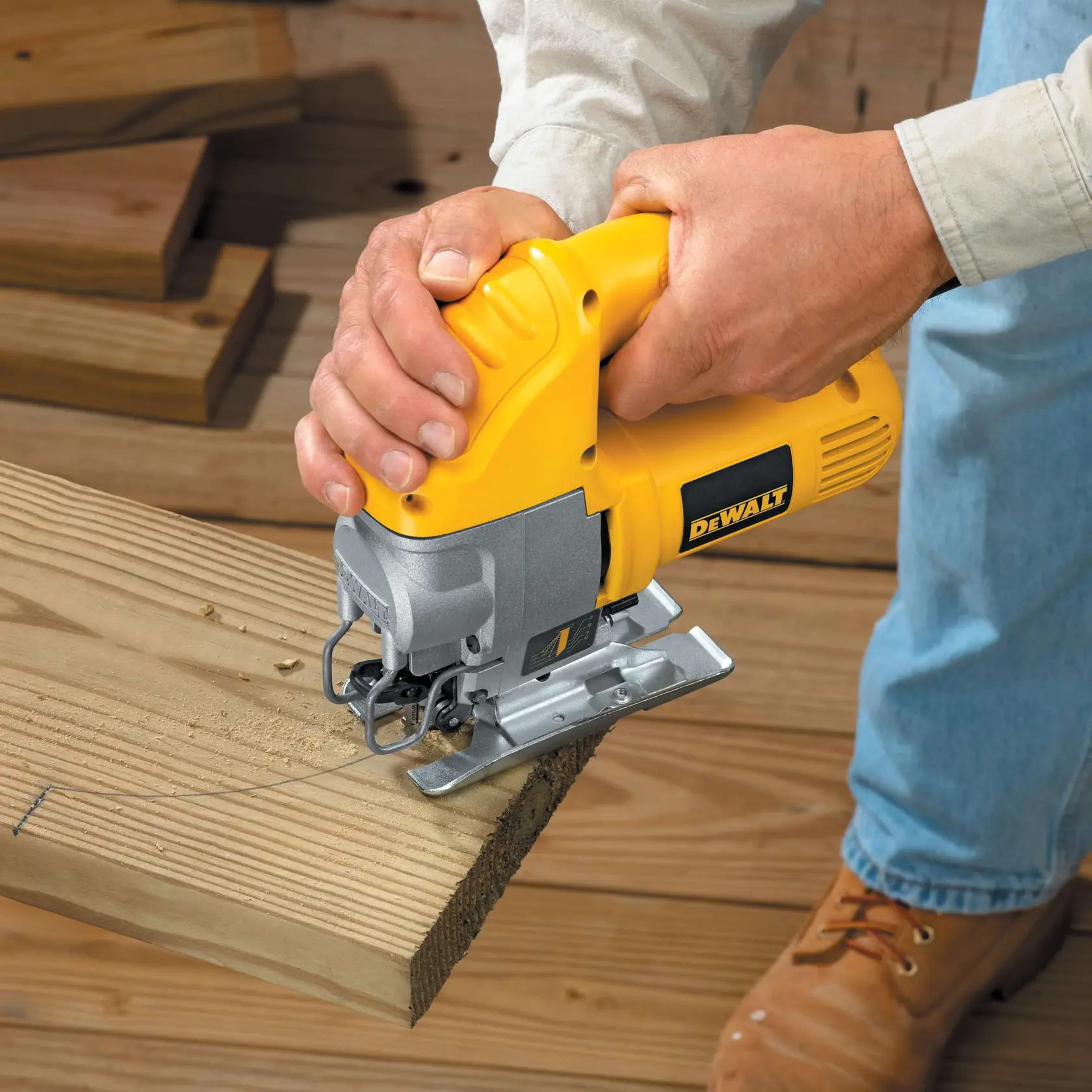 A DEWALT jigsaw being used to cut wood, with a label stating '0 - 3,100 strokes per minute.'
