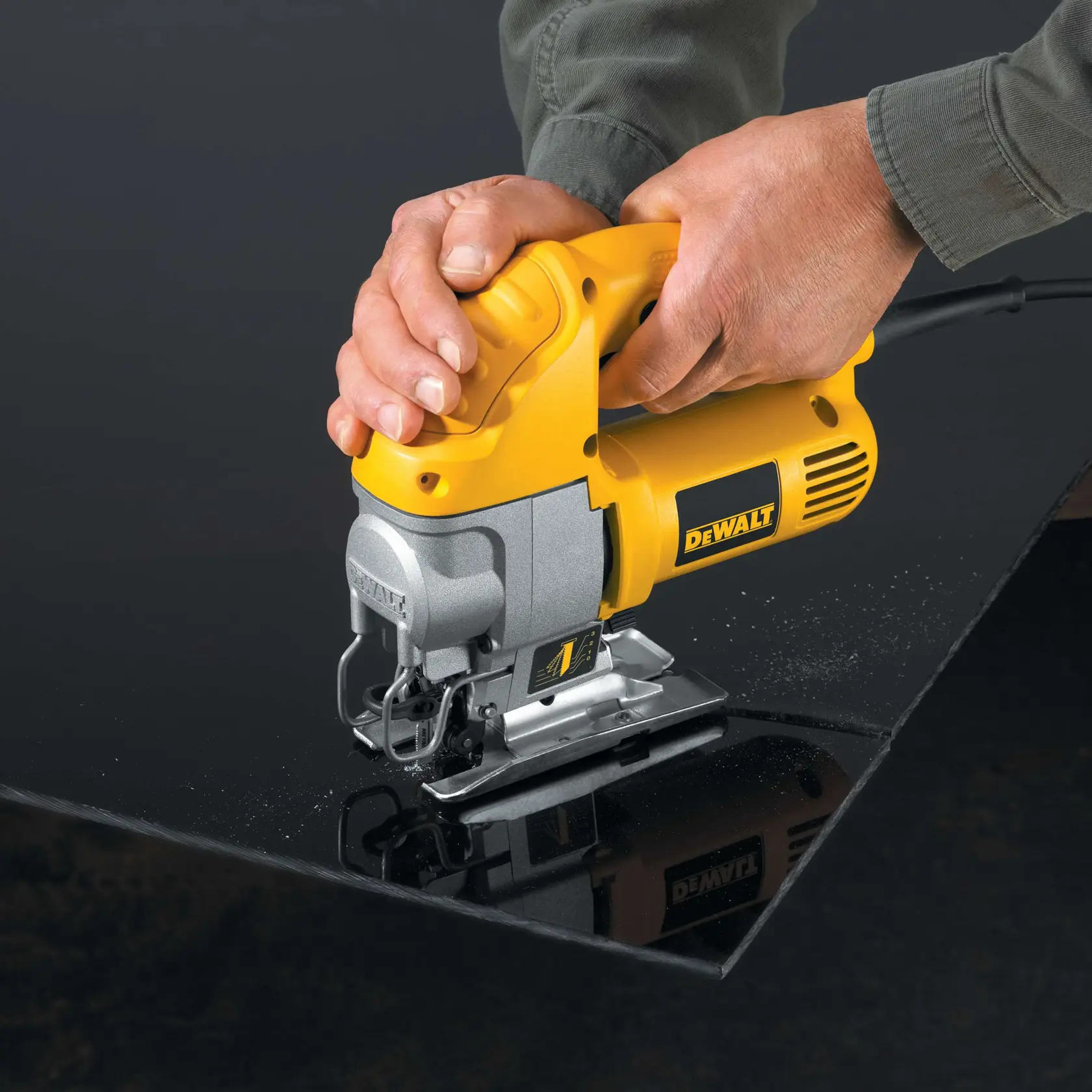 Close-up of a DEWALT jigsaw making a beveled cut on wood, with a label indicating it can be angled from 0° to 45° for beveled cuts.
