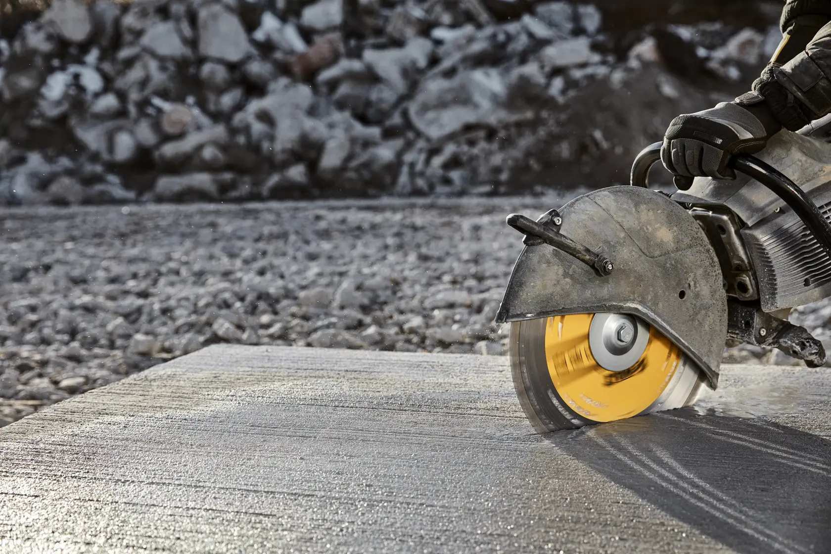 DEWALT 14 inch (355 mm) segmented diamond blade for cutting, featuring high-strength steel core, integrated cooling vents, tall diamond segments, and segmented turbo design. The yellow and silver blade is labeled XP and suitable for multiple cutting purposes.